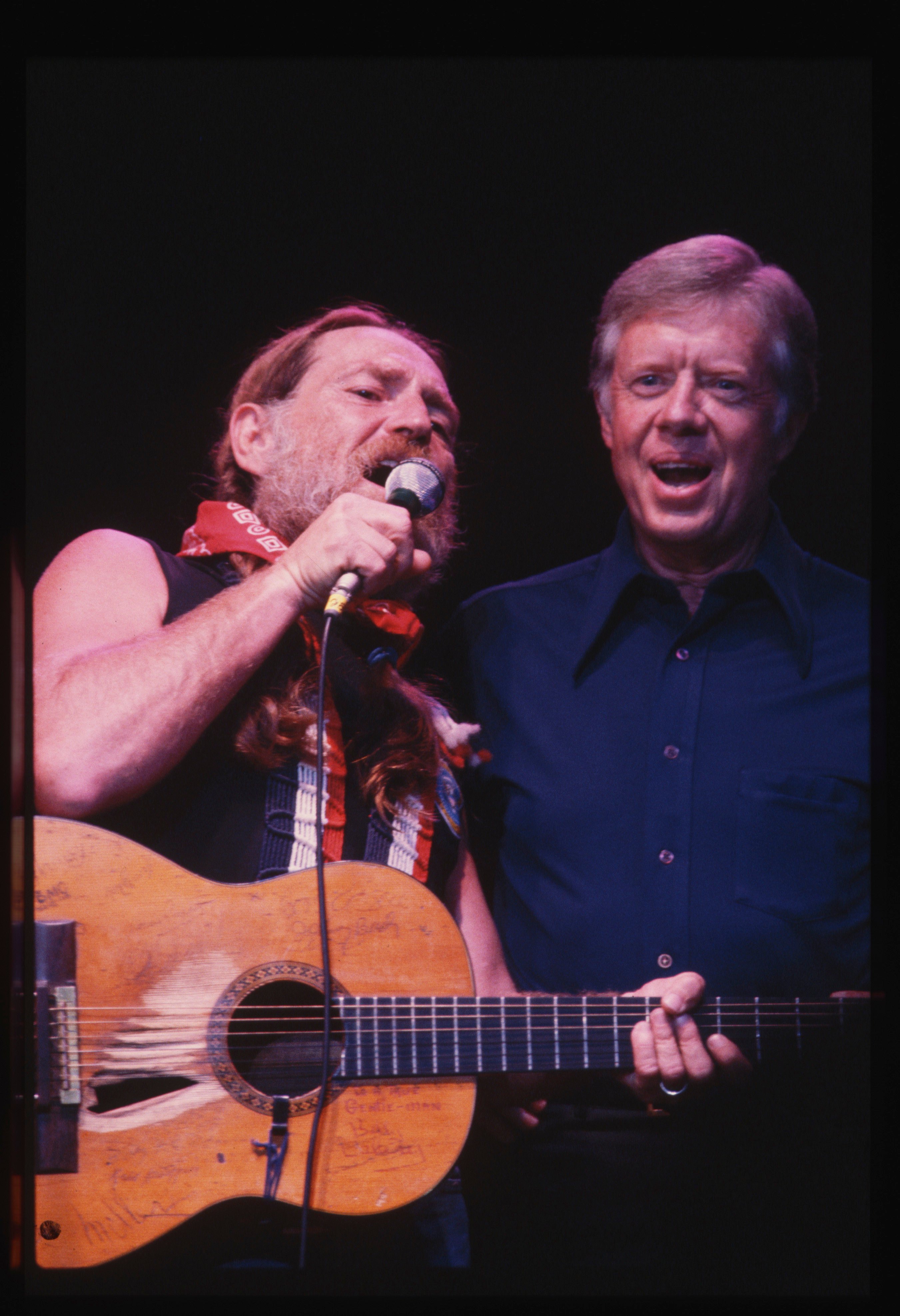 Then-US president Jimmy Carter (right) sings “Georgia on My Mind” with country music star Willie Nelson during a concert in Maryland in the United States in 1978. Photo: Getty Images