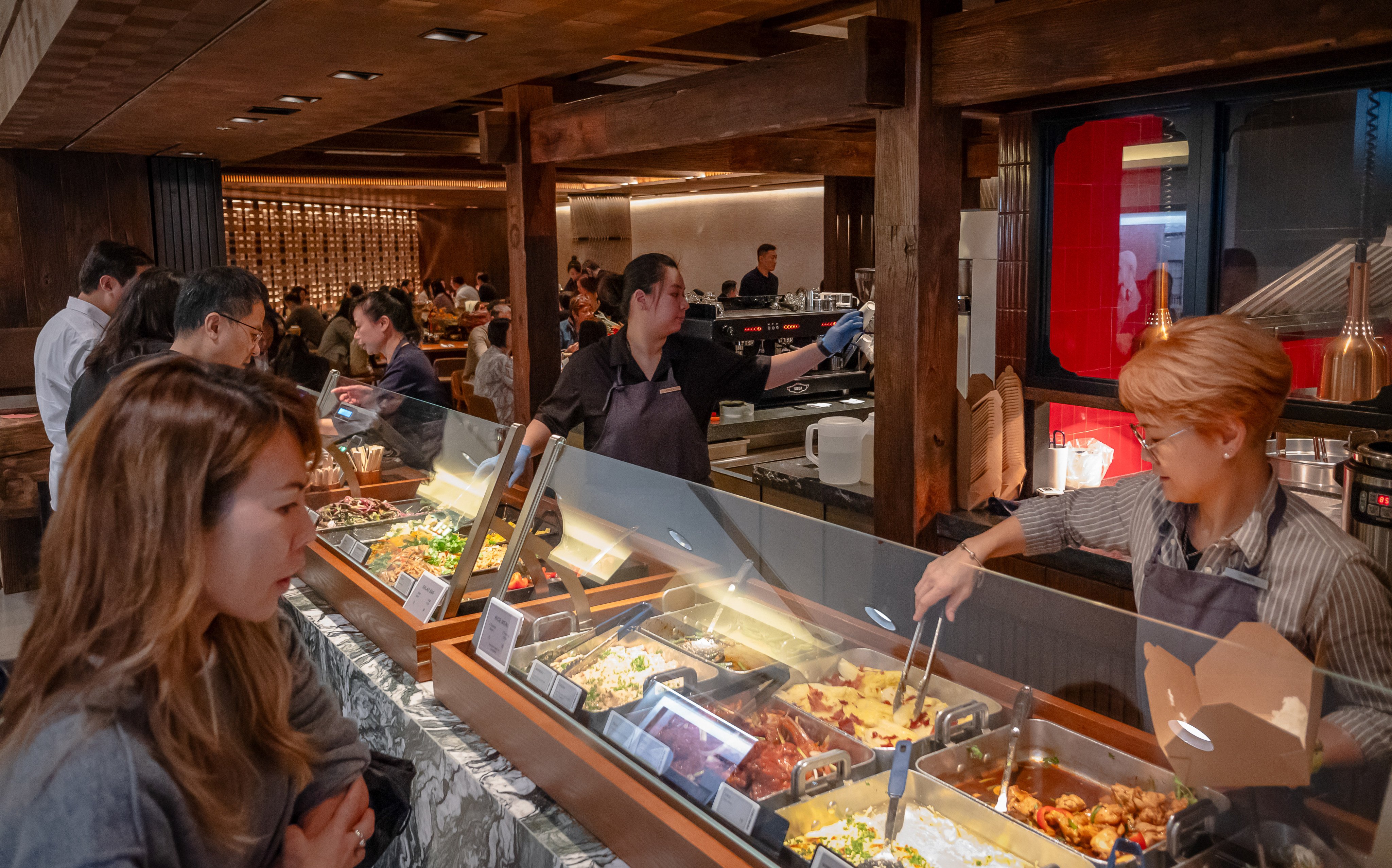 Customers line up at a two-dish rice counter in a shopping mall in Central district on November 22. Photo: Alexander Mak