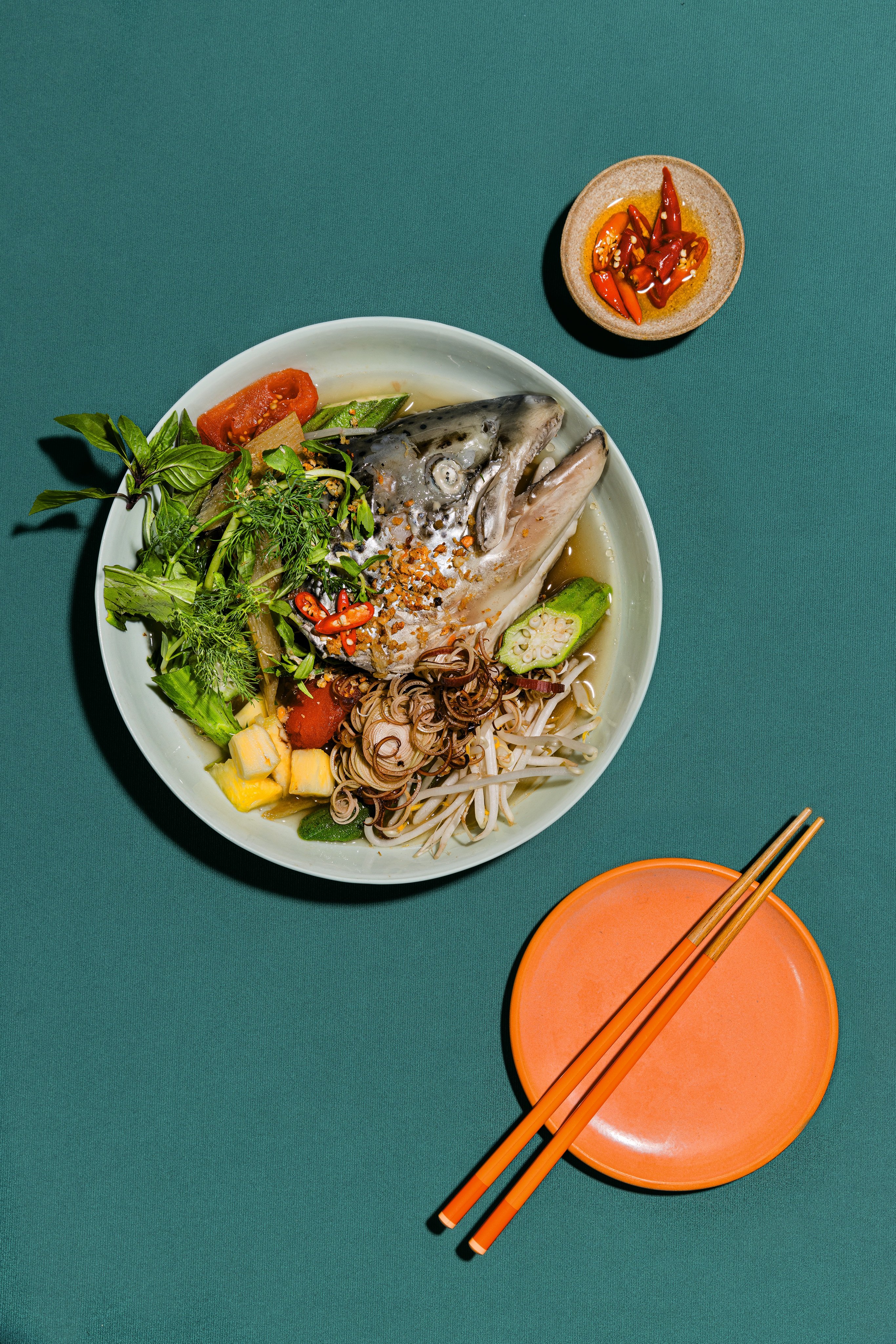 Tu David Phu’s hot-pot-style salmon head sour soup. Photo: Penguin Random House