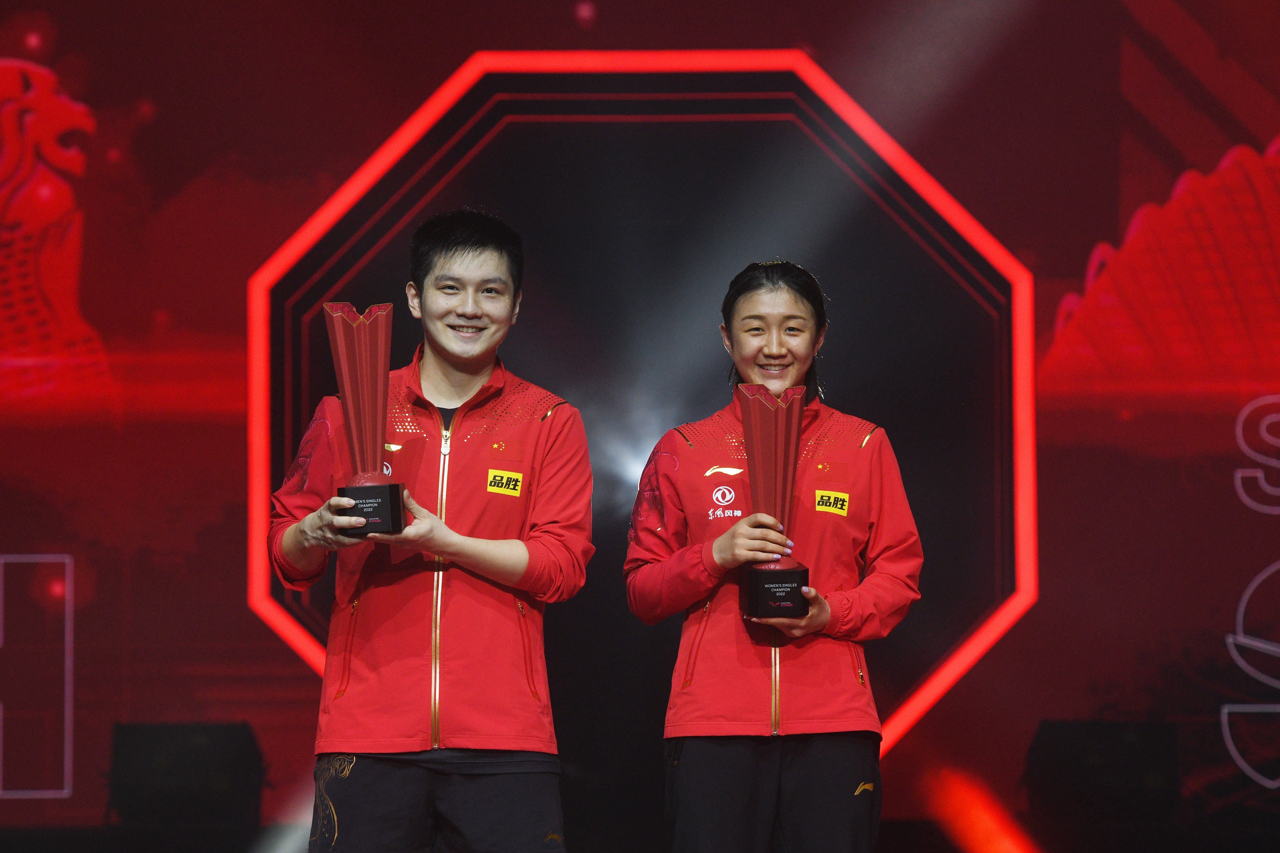 China’s Fan Zhendong (left) and his compatriot Chen Meng with their winning trophies at the WTT Singapore Smash 2022. Photo: Xinhua