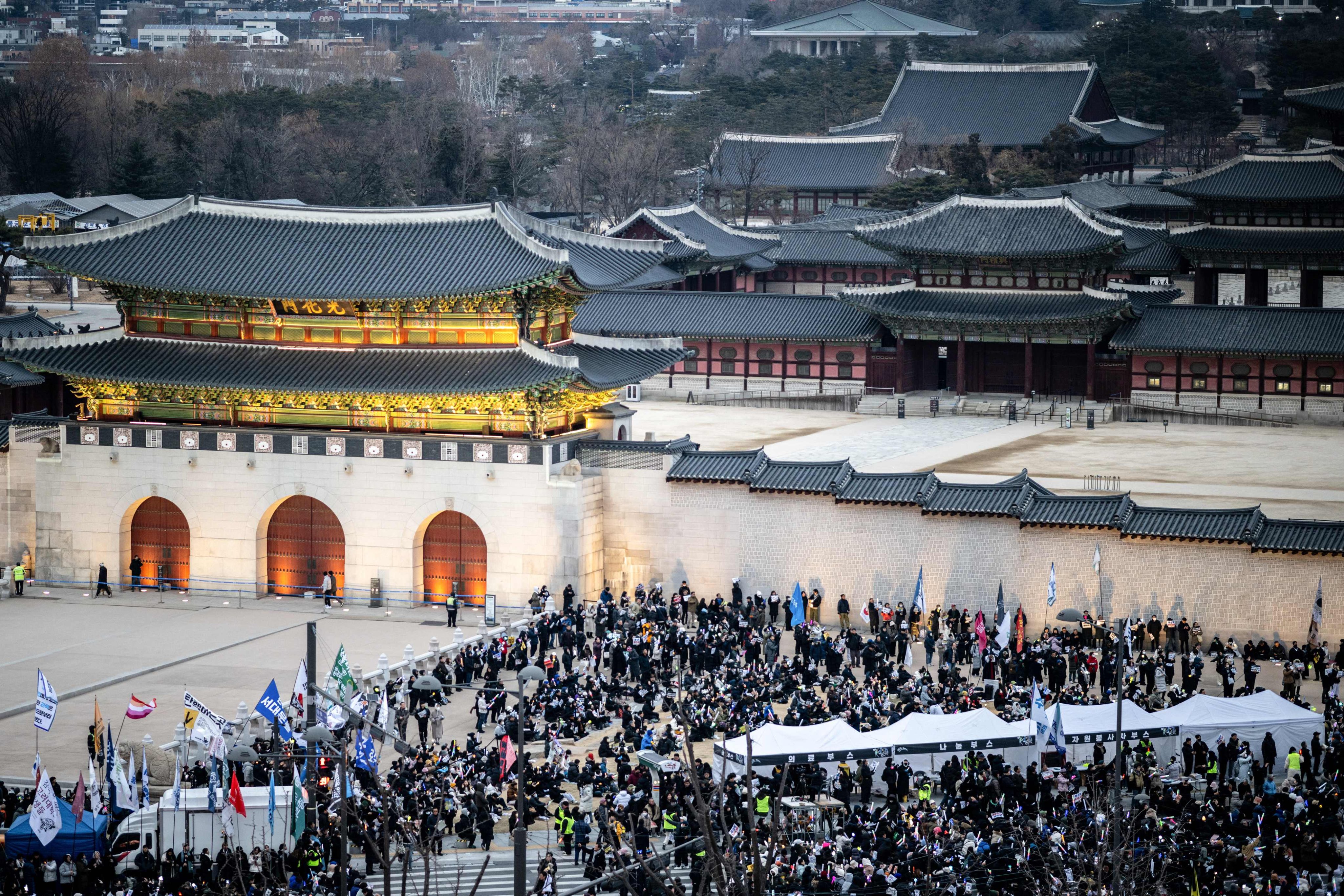 People gather for a rally to protest impeached South Korean President Yoon Suk-yeol in front of the Gwanghwamun Gate in Seoul on Saturday. Photo: AFP