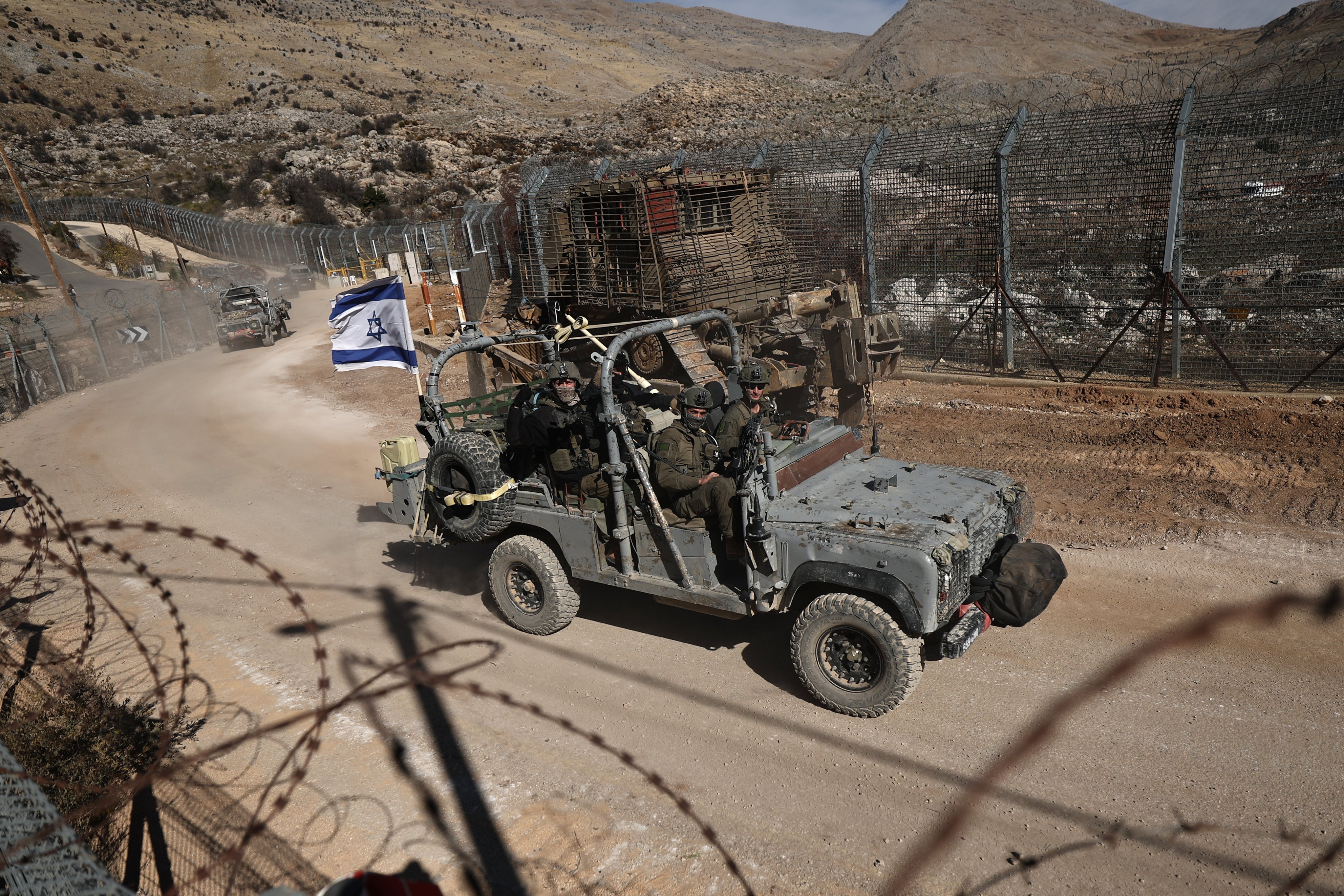 Israeli soldiers on a military vehicle near the border between Israel and Syria. On Saturday the Biden administration notified Congress of a US$8 billion weapons sale to Israel. Photo: EPA-EFE