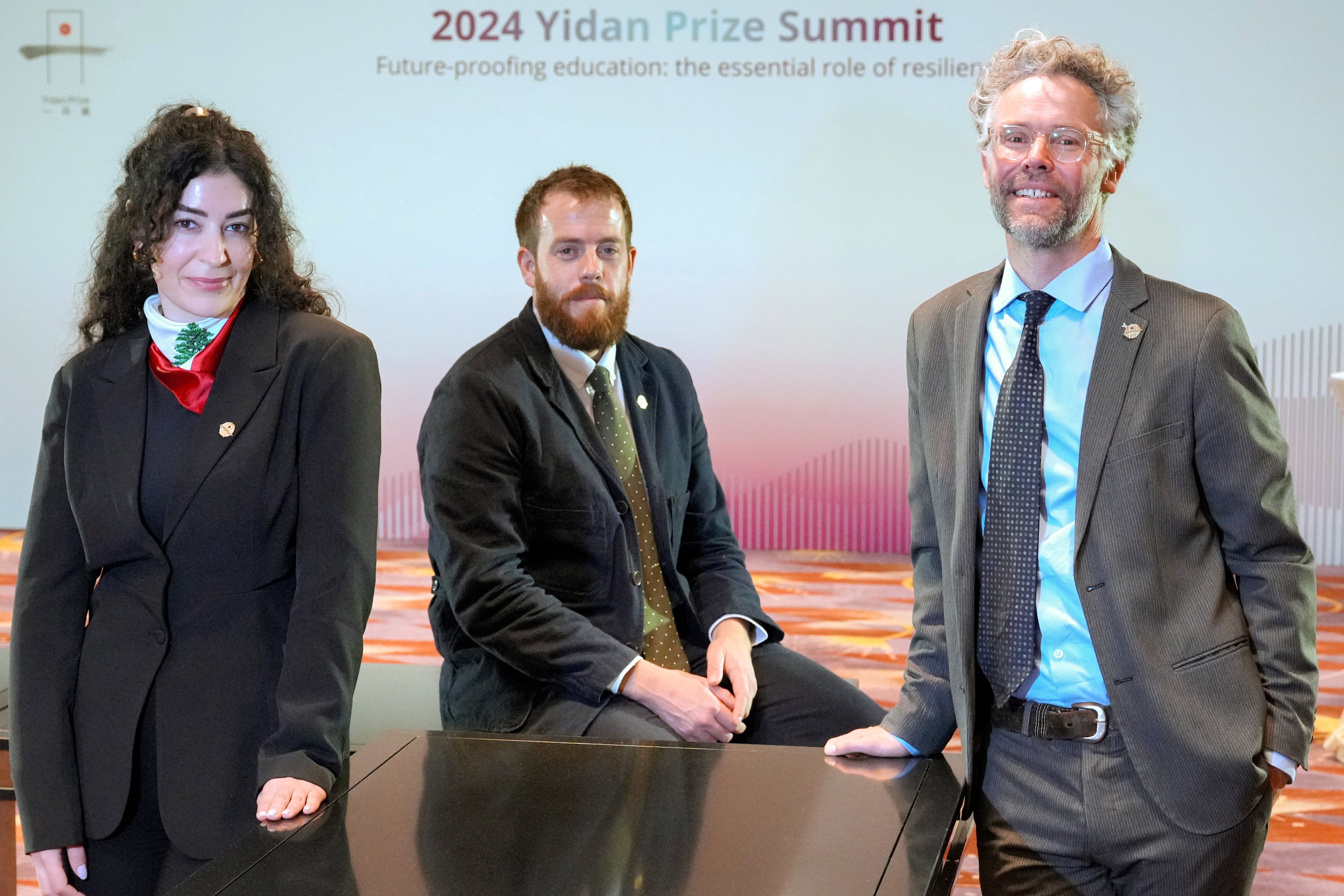 (From left) The War Child Alliance’s Marwa Zahr, Luke Stannard and Mark Jordans, winners of the 2024 Yidan Prize for Education Development. Photo: May Tse