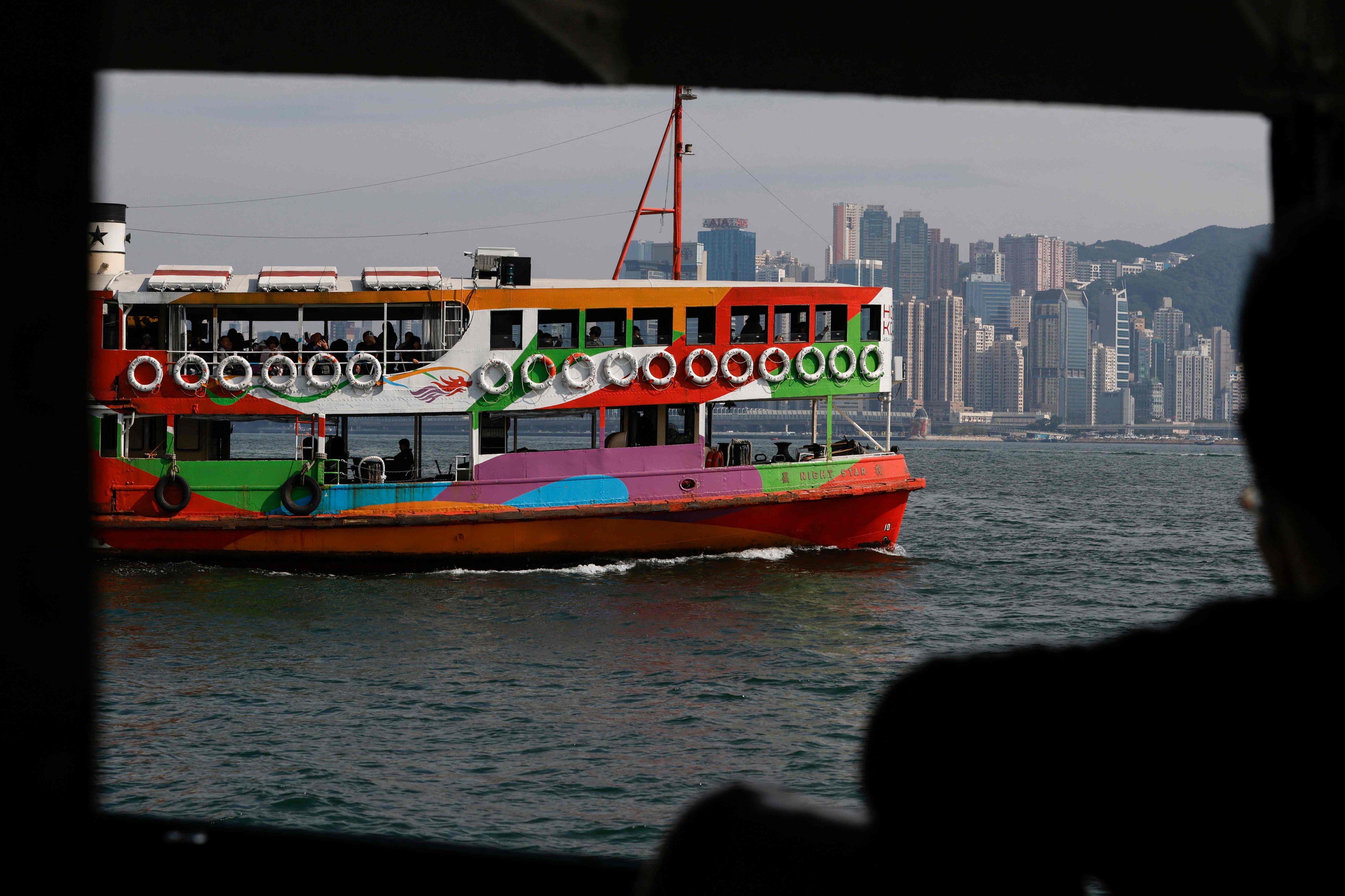 A Star Ferry is seen from another ferry as it sails across Victoria Harbour in Hong Kong on December 22. Hong Kong’s economic indicators clearly show that the city has yet to recover from the pandemic. Photo: AFP