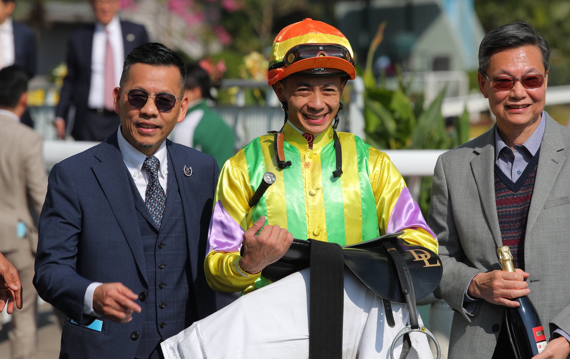 Trainer Frankie Lor (left) and jockey Derek Leung celebrate Sword Point’s success.