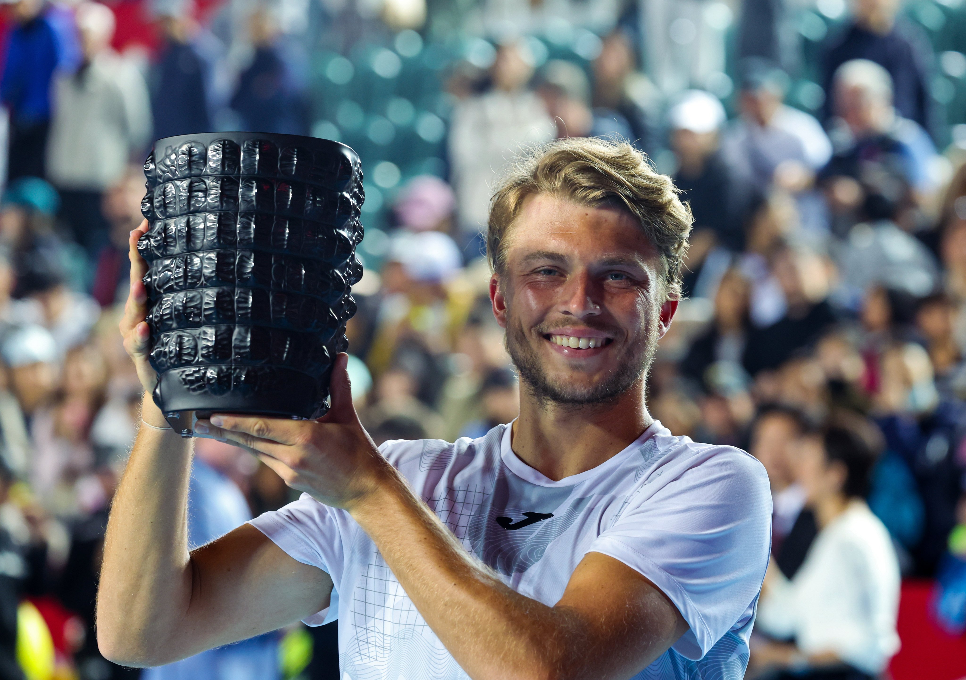 Alexandre Muller holds the trophy after winning the Bank of China Hong Kong Tennis Open at Victoria Park. Photo: Dickson Lee