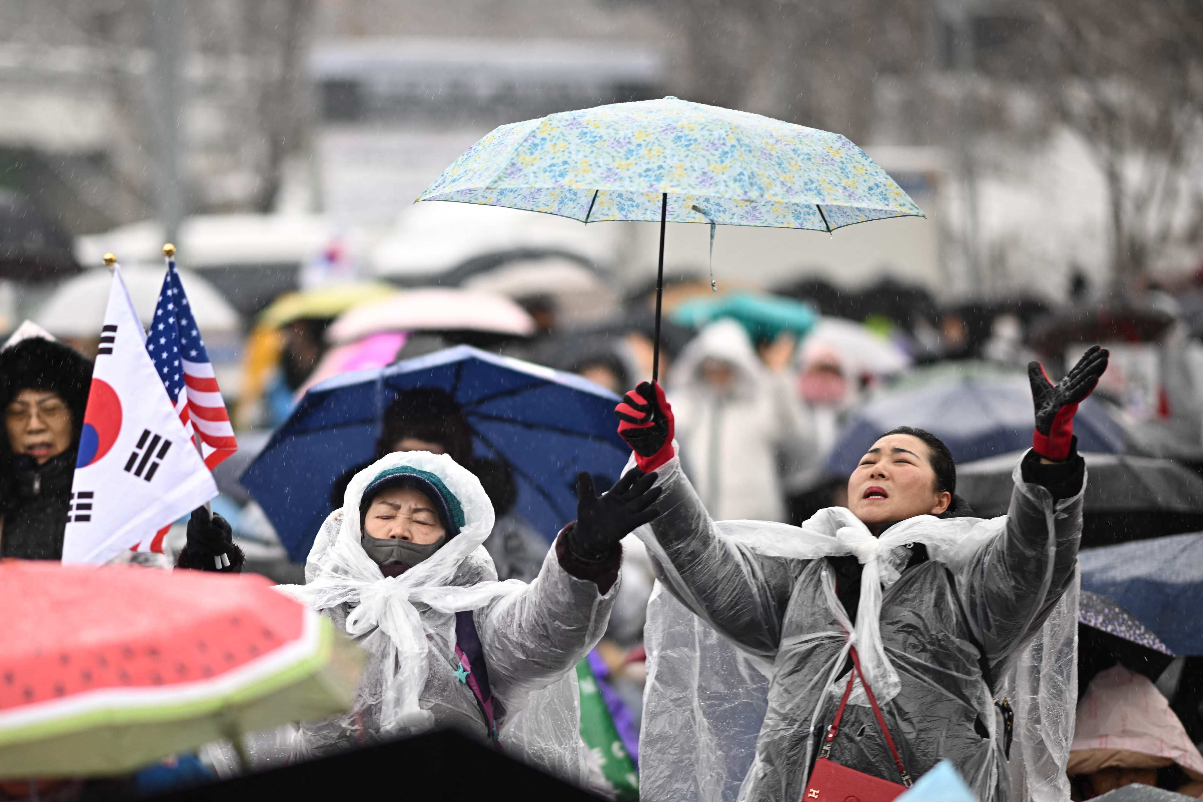 Thousands of South Korean protesters for and against President Yoon Suk-yeol braved a snowstorm to stage opposing demonstrations. Photo: AFP