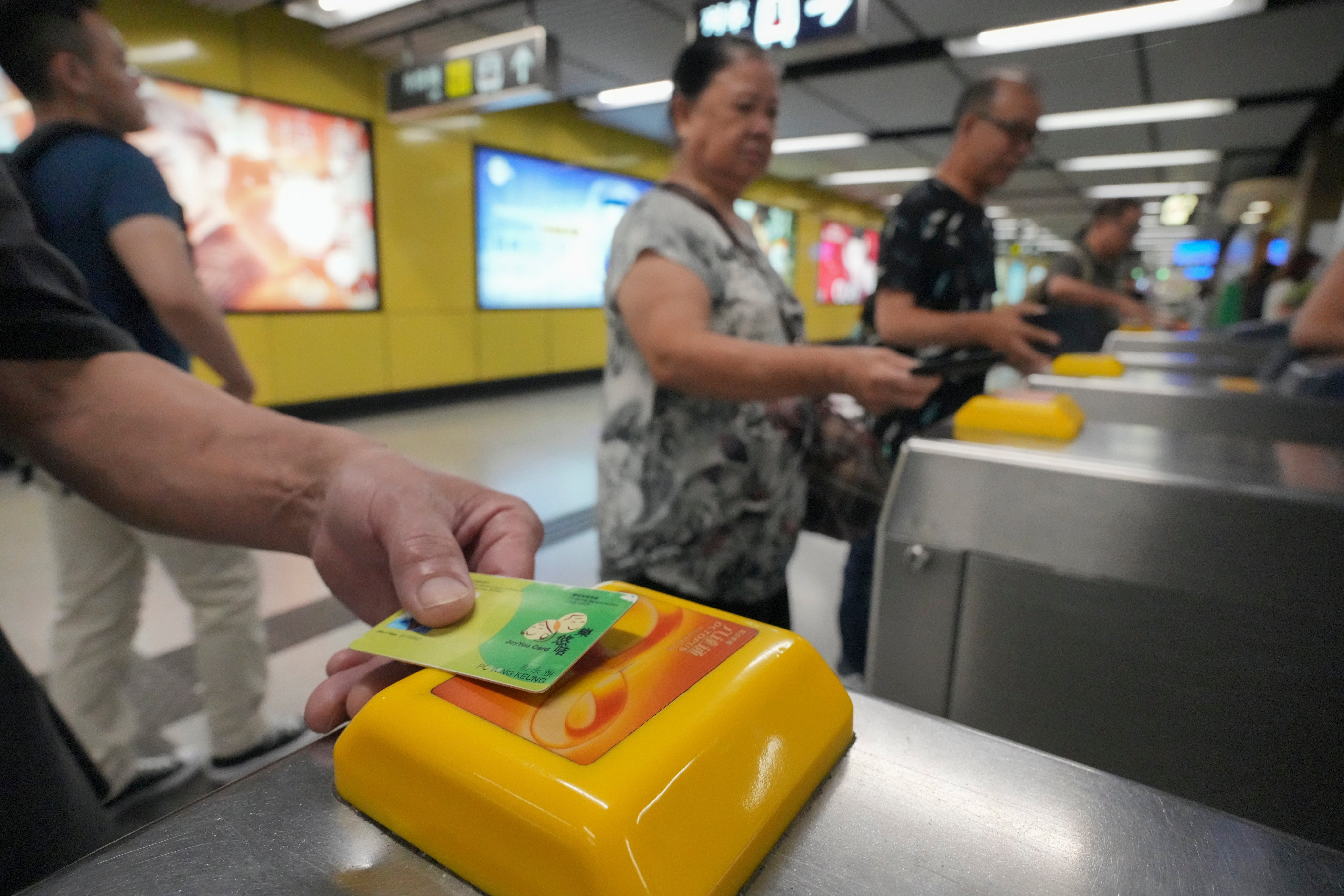 Commuters use the JoyYou Card at Wong Tai Sin MTR station on August 25. Without the HK$2 fare scheme, many elderly people would likely reduce their use of public transport. Photo: May Tse 