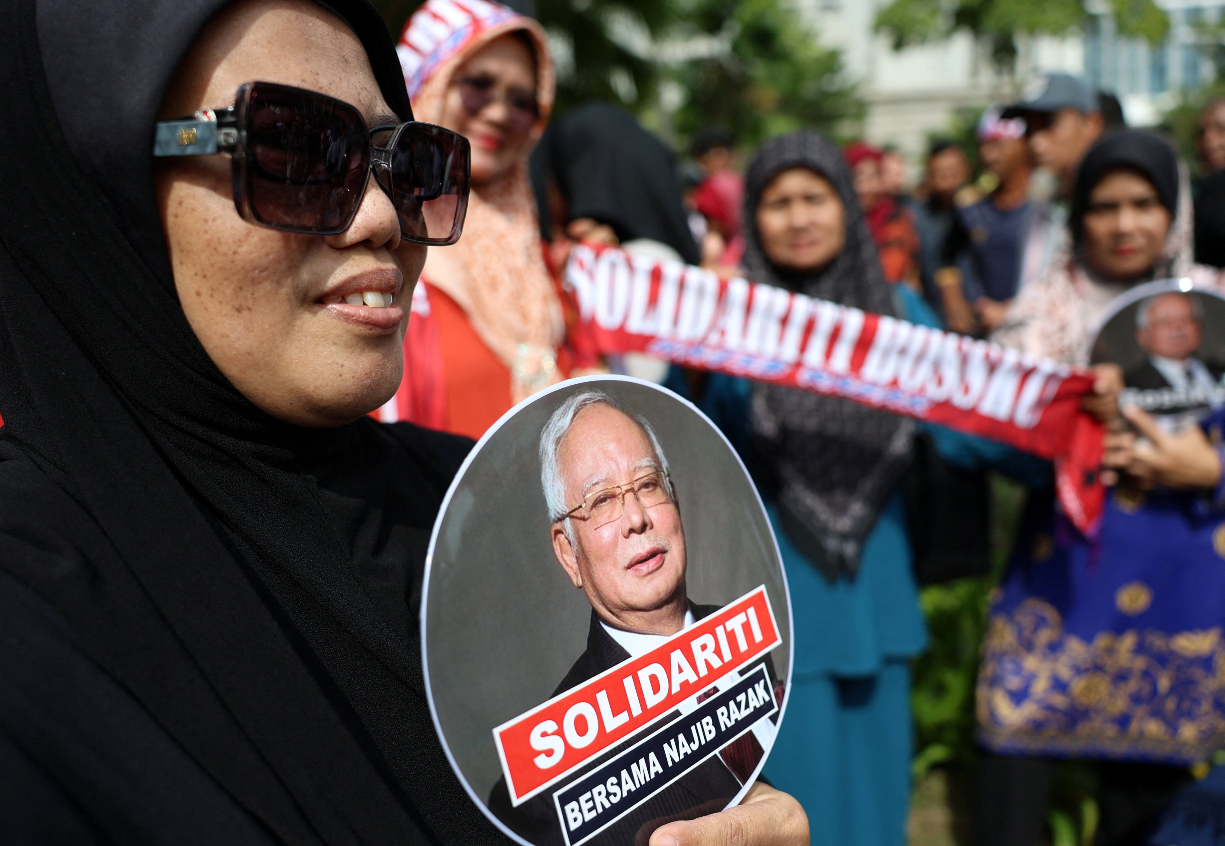 A supporter of Malaysia’s former prime minister Najib Razak takes part in a solidarity rally outside the Court of Appeal in Putrajaya on Monday. Photo: Reuters