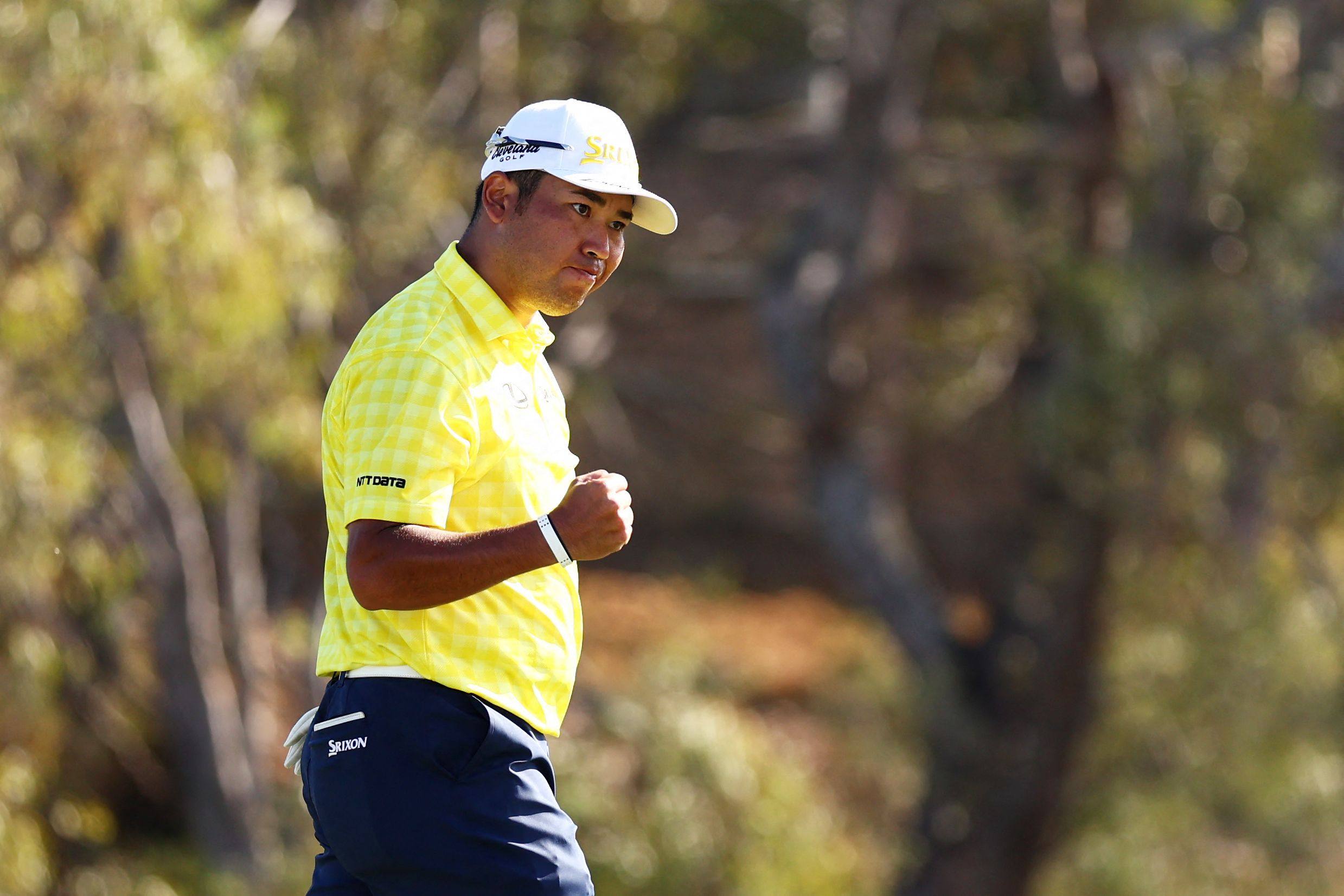 Hideki Matsuyama celebrates on the 18th green after making the record-breaking birdie putt at the Plantation Course of the Kapalua Golf Club on Sunday. Photo: AFP 