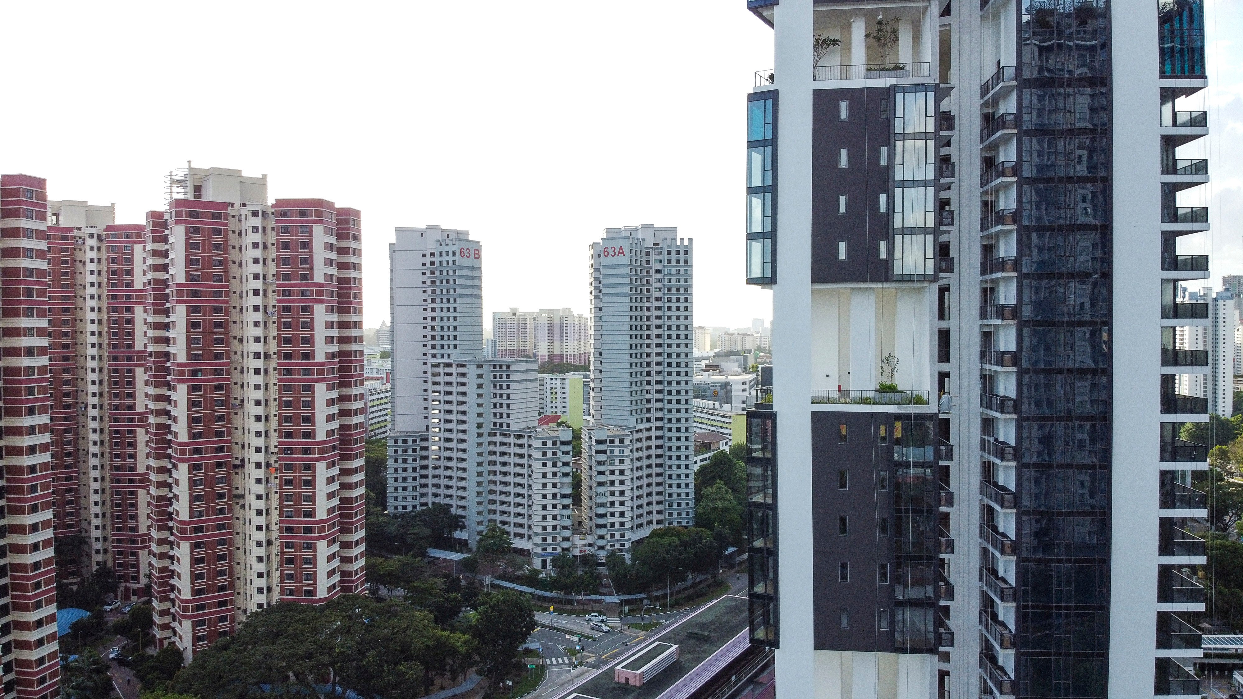 Public housings under the Housing and Development Board (left) and private residential buildings (right) under construction in Singapore in 2020. Photo: Roy Issa