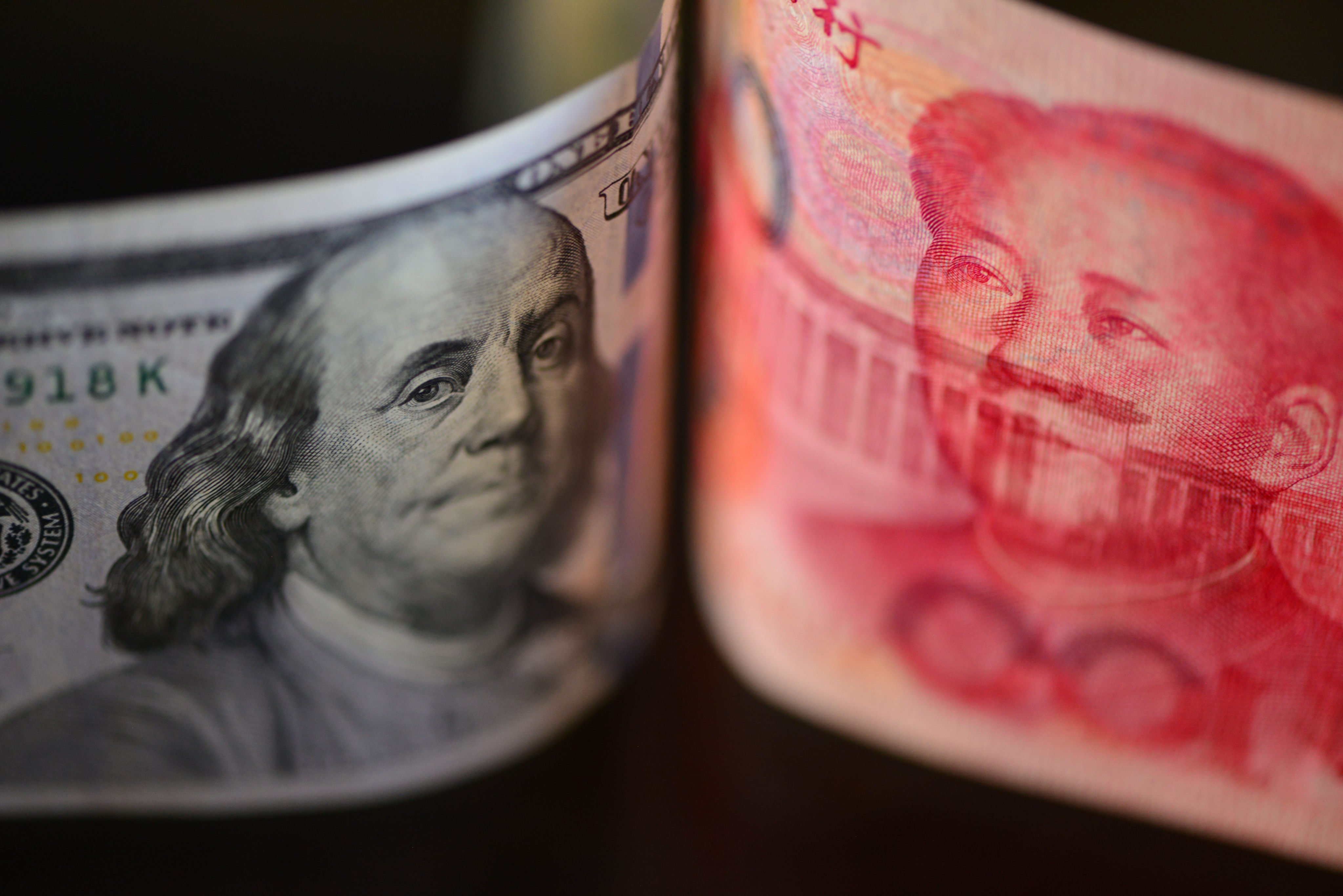 A photo taken in Fuyang, China, on September 5, 2024, shows US dollar and Chinese yuan banknotes. Photo: Costfoto/NurPhoto via Getty Images