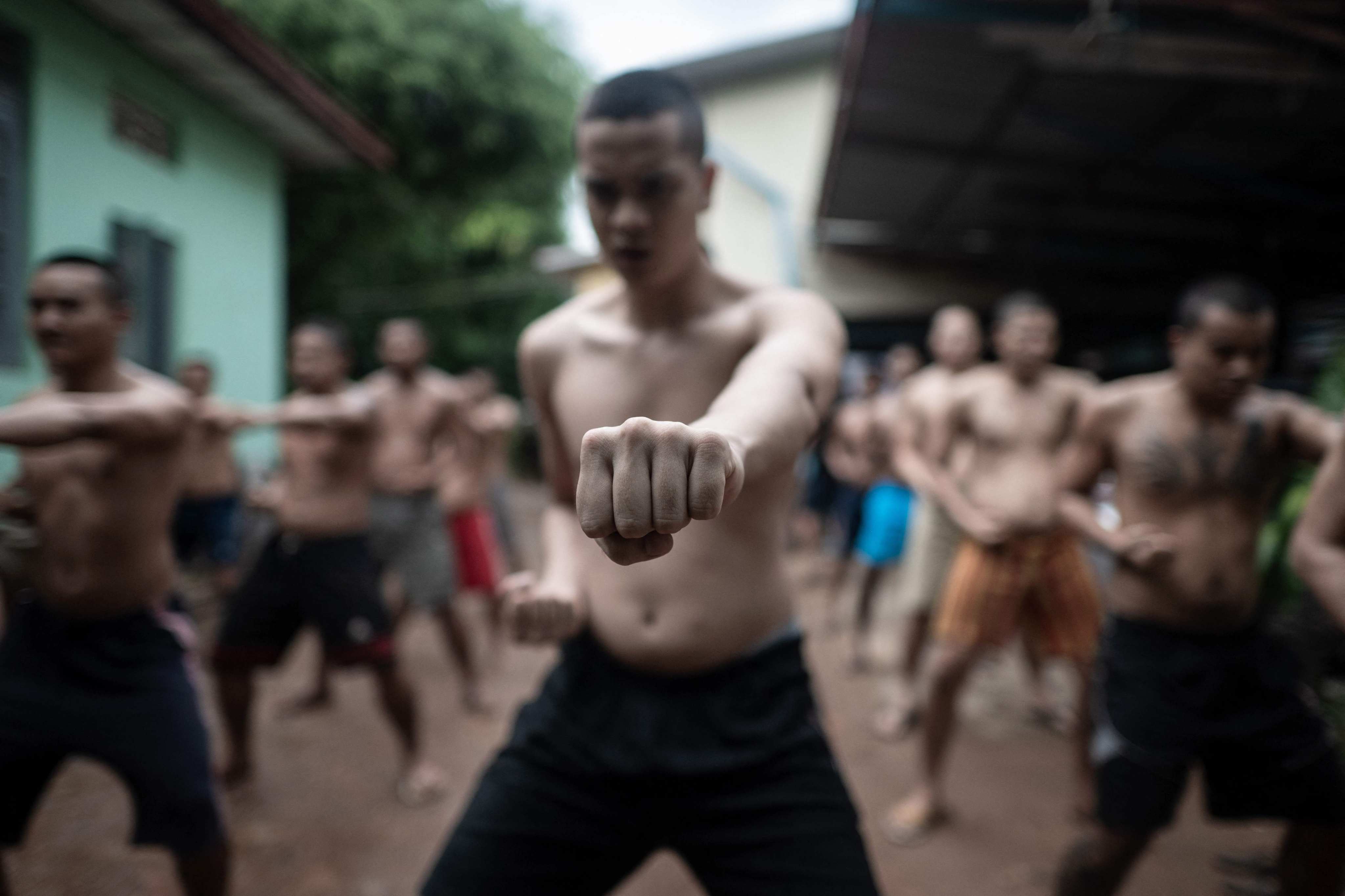 Recovering drug addicts exercise during a rehabilitation program at the Metta Saneain rehab centre in Yangon, Myanmar. Photo: AFP