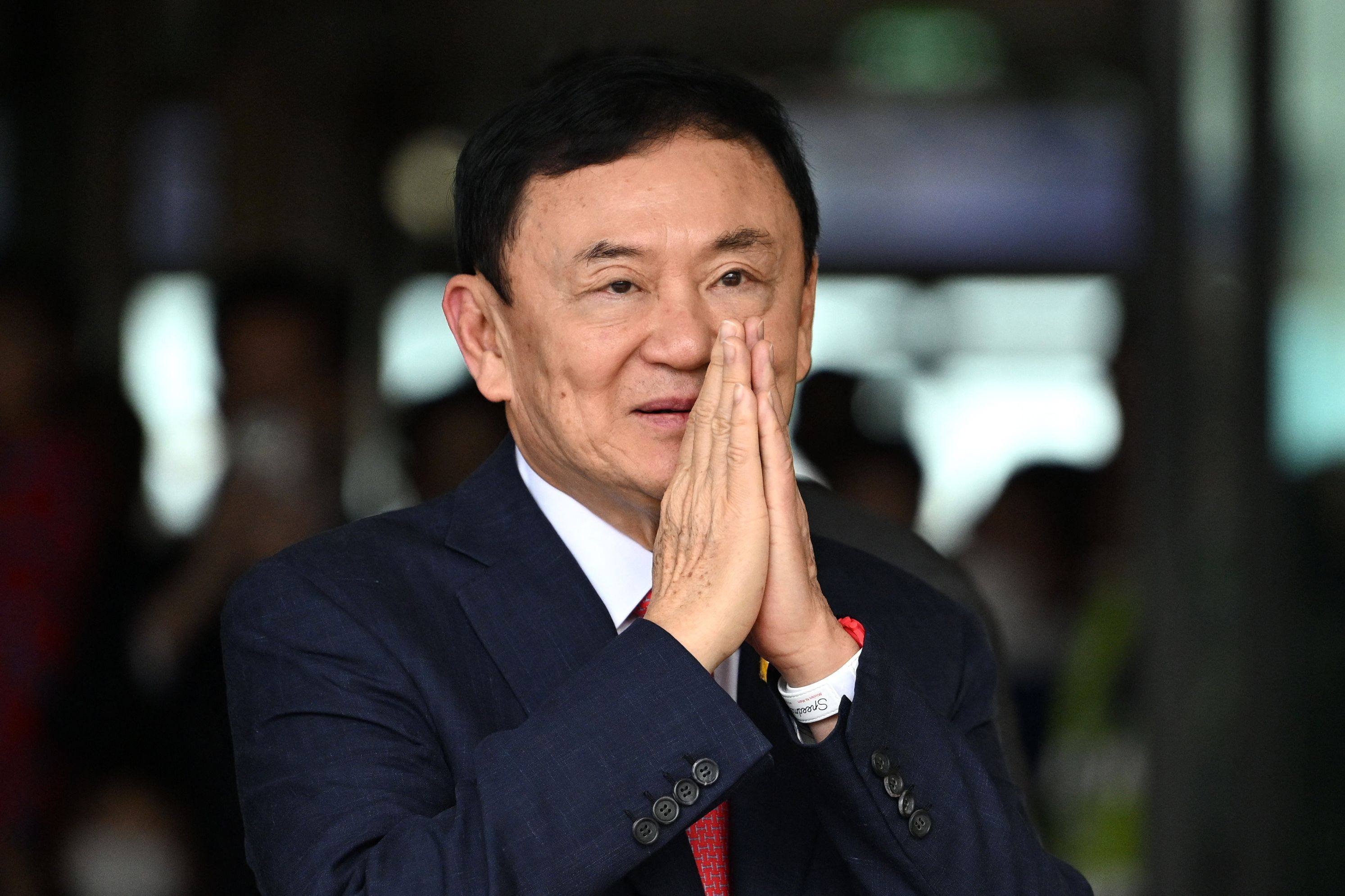 Thailand’s former prime minister Thaksin Shinawatra greets his supporters after landing at Bangkok’s Don Mueang airport on August 22, 2023. Photo: AFP