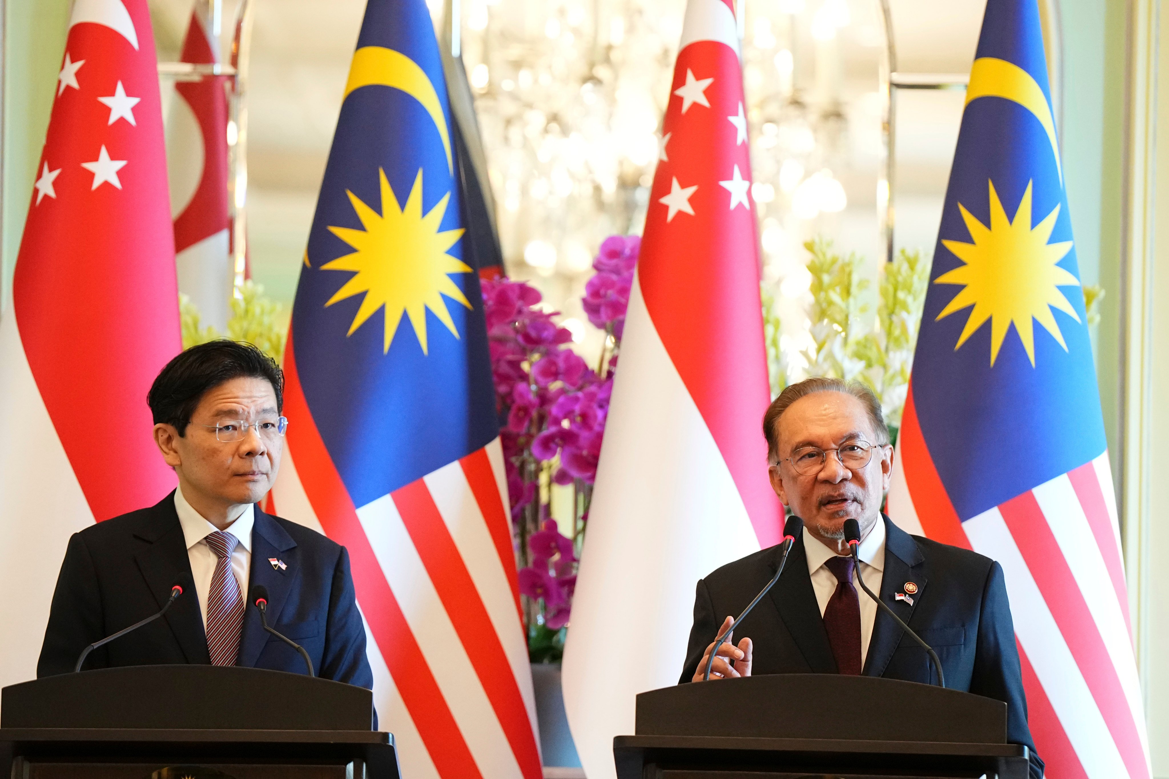 Malaysian Prime Minister Anwar Ibrahim speaks during a press conference with Singapore Prime Minister Lawrence Wong in Putrajaya on Tuesday. Photo: AP