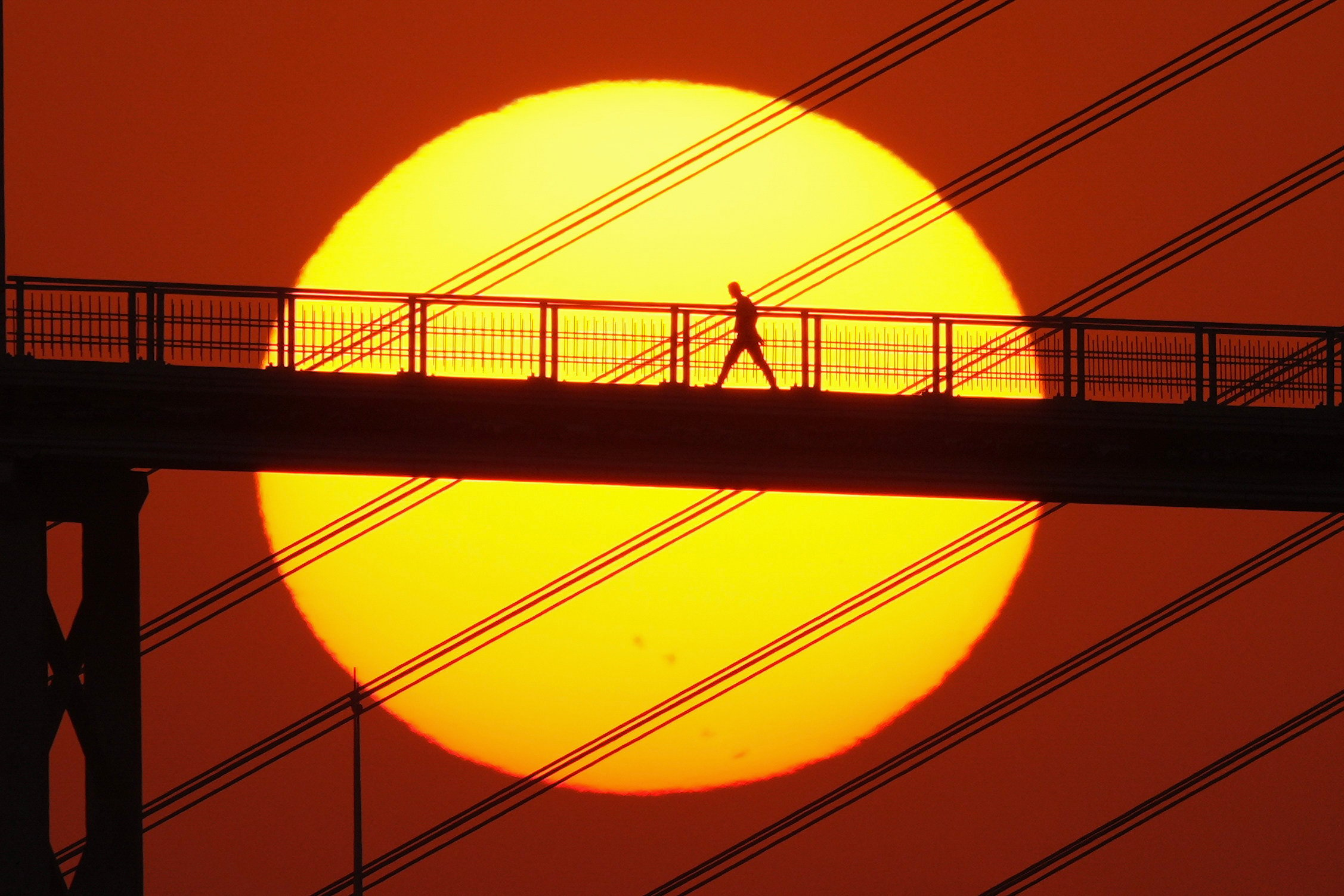 The sun sets on Sai Van Bridge in Macau on December 18. Although there is no stock exchange in Macau, the city has authorised two financial asset exchange platforms. Photo: Eugene Lee