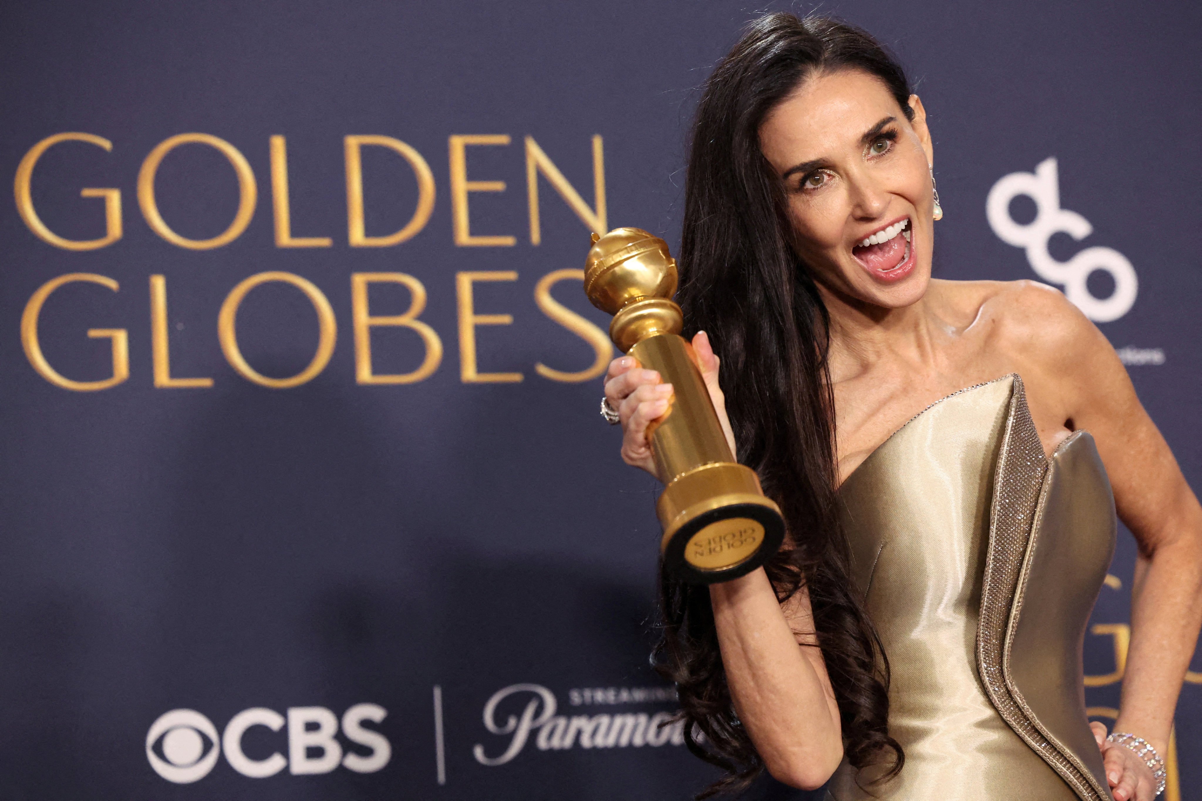 Demi Moore poses with the award for best actress in a musical or comedy, for The Substance, at the Golden Globes. Photo: Reuters