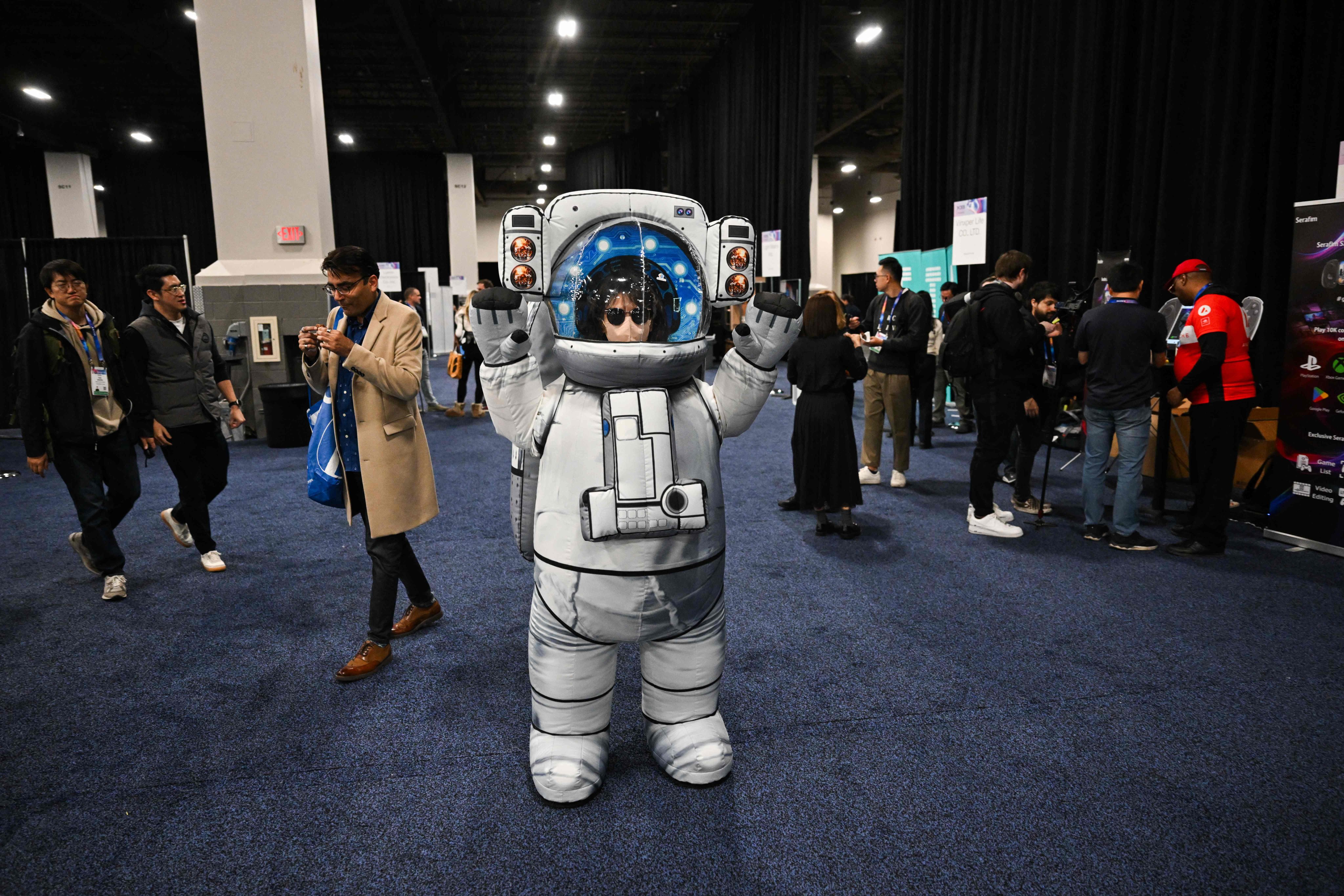 Attendees are given a sneak peak on January 5 into the latest gadgets at this year’s Consumer Electronics Show in Las Vegas, Nevada, where gadgets, robots and vehicles imbued with artificial intelligence will once again vie for attention. Photo: AFP