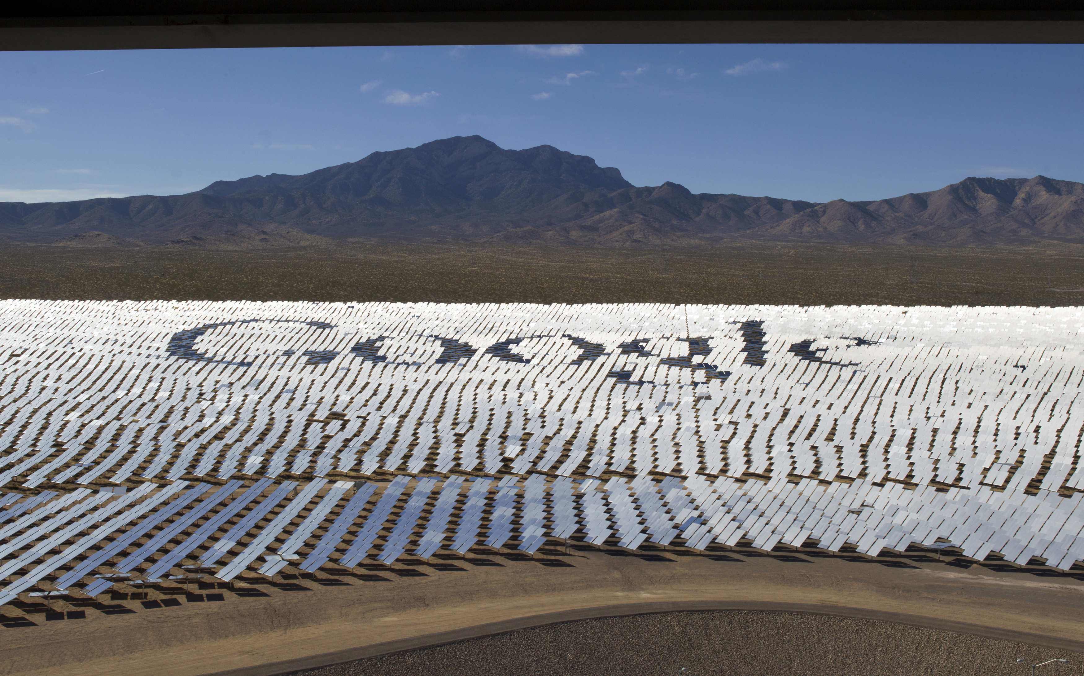 Google spelled out in heliostats at a joint project solar energy farm in the Mojave Desert near the California-Nevada border in 2014. Tech giants must take responsibility for their climate impact worldwide, rather than simply exporting their climate impact abroad. Photo: Reuters