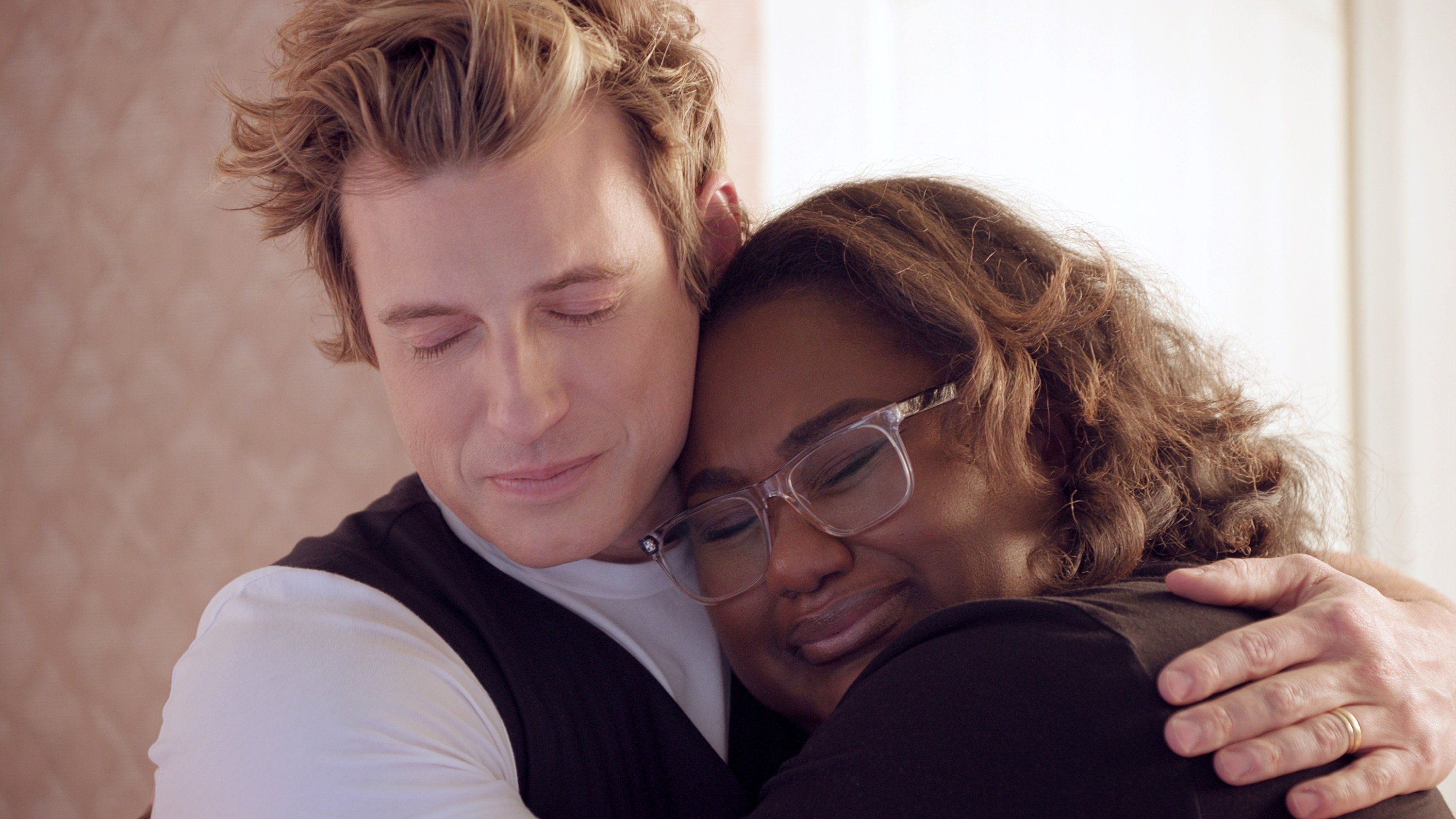 Queer Eye interior designer Jeremiah Brent hugs a participant in the new season of the Netflix show. He reveals how he renovates homes in days. Photo: TNS