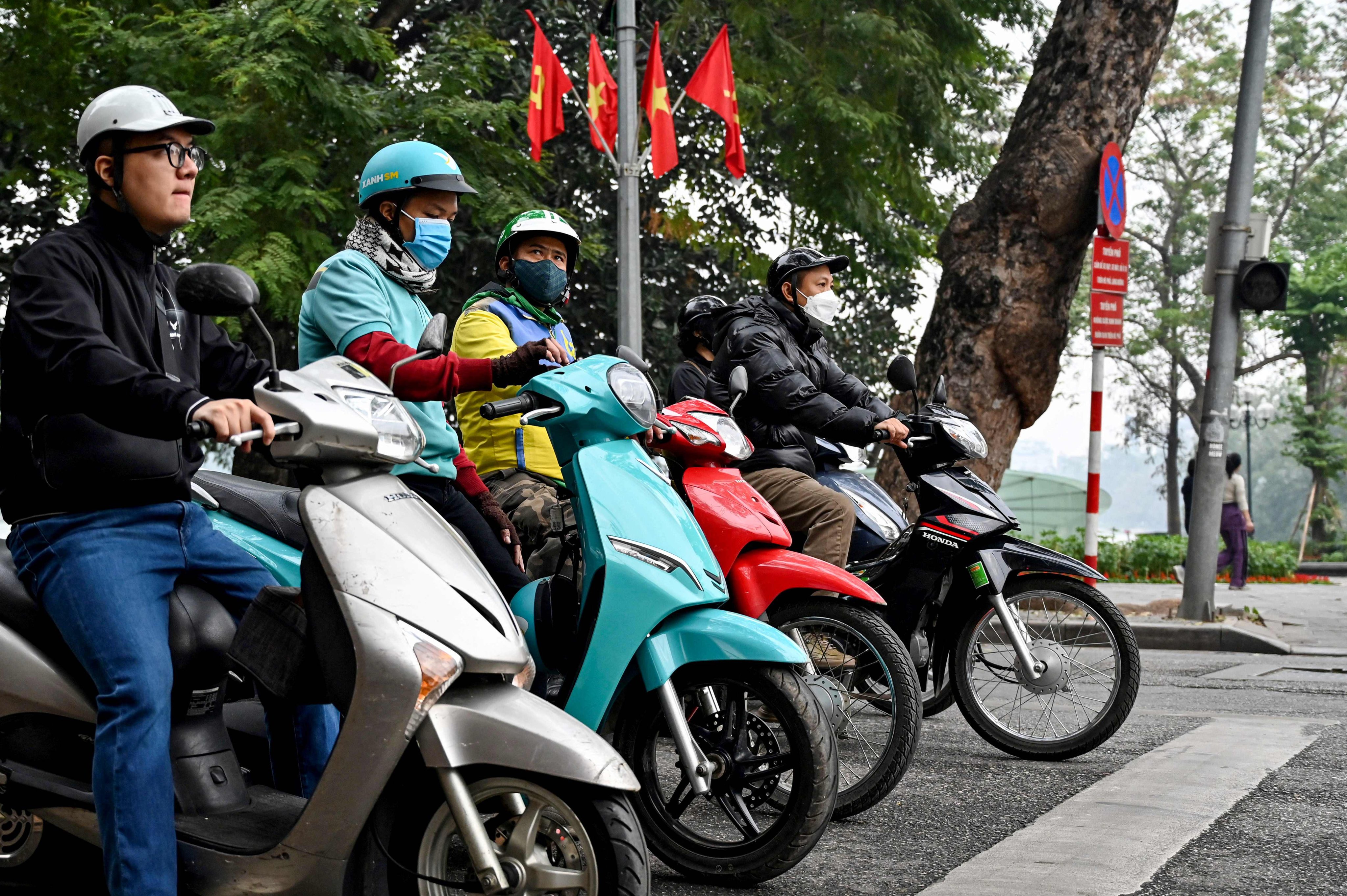 Motorists wait at a red light at an intersection in Hanoi on Wednesday. Photo: AFP