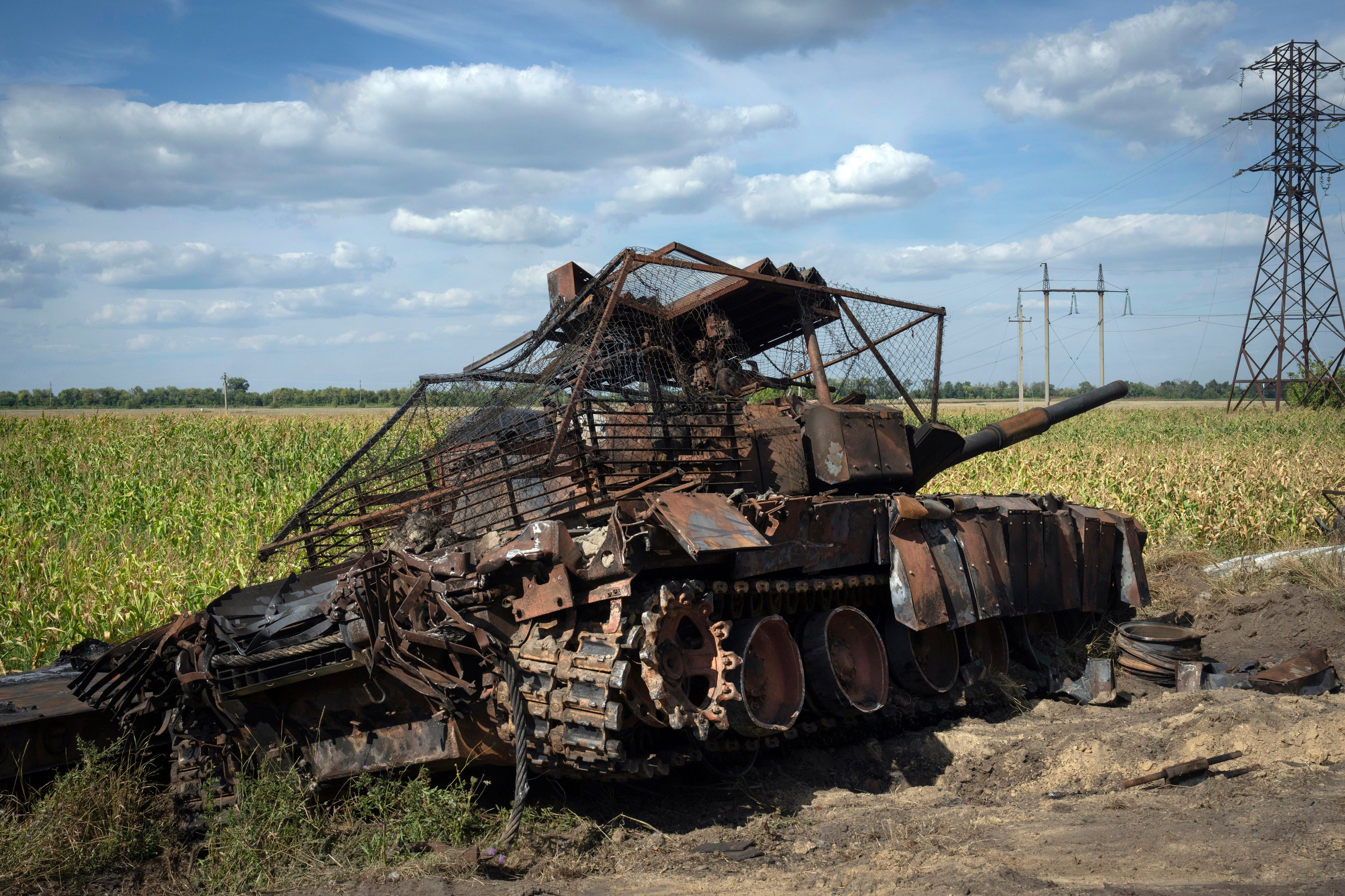 A destroyed Russian tank sits on a roadside near the town of Sudzha, in the Kursk region, in August 2024. Photo: AP