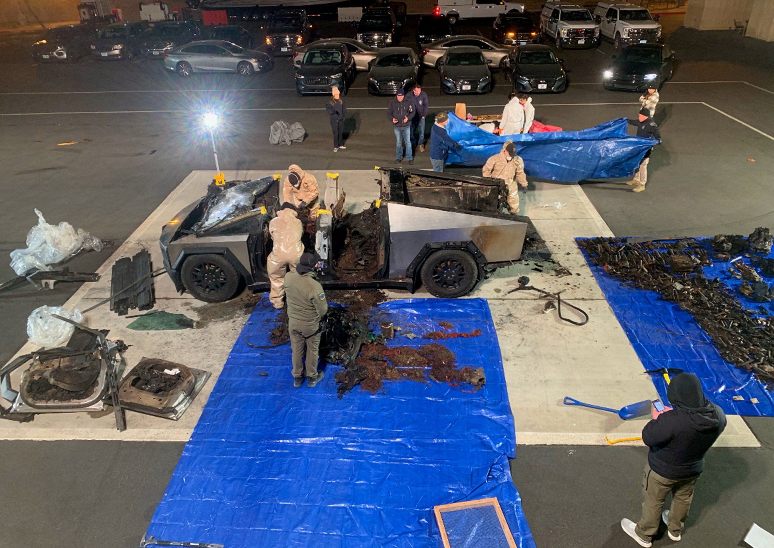 Investigators inspect a damaged Tesla Cybertruck on January 2 after it exploded in front of the Trump International Hotel in Las Vegas, Nevada. Photo: Las Vegas Metropolitan Police Department via Reuters