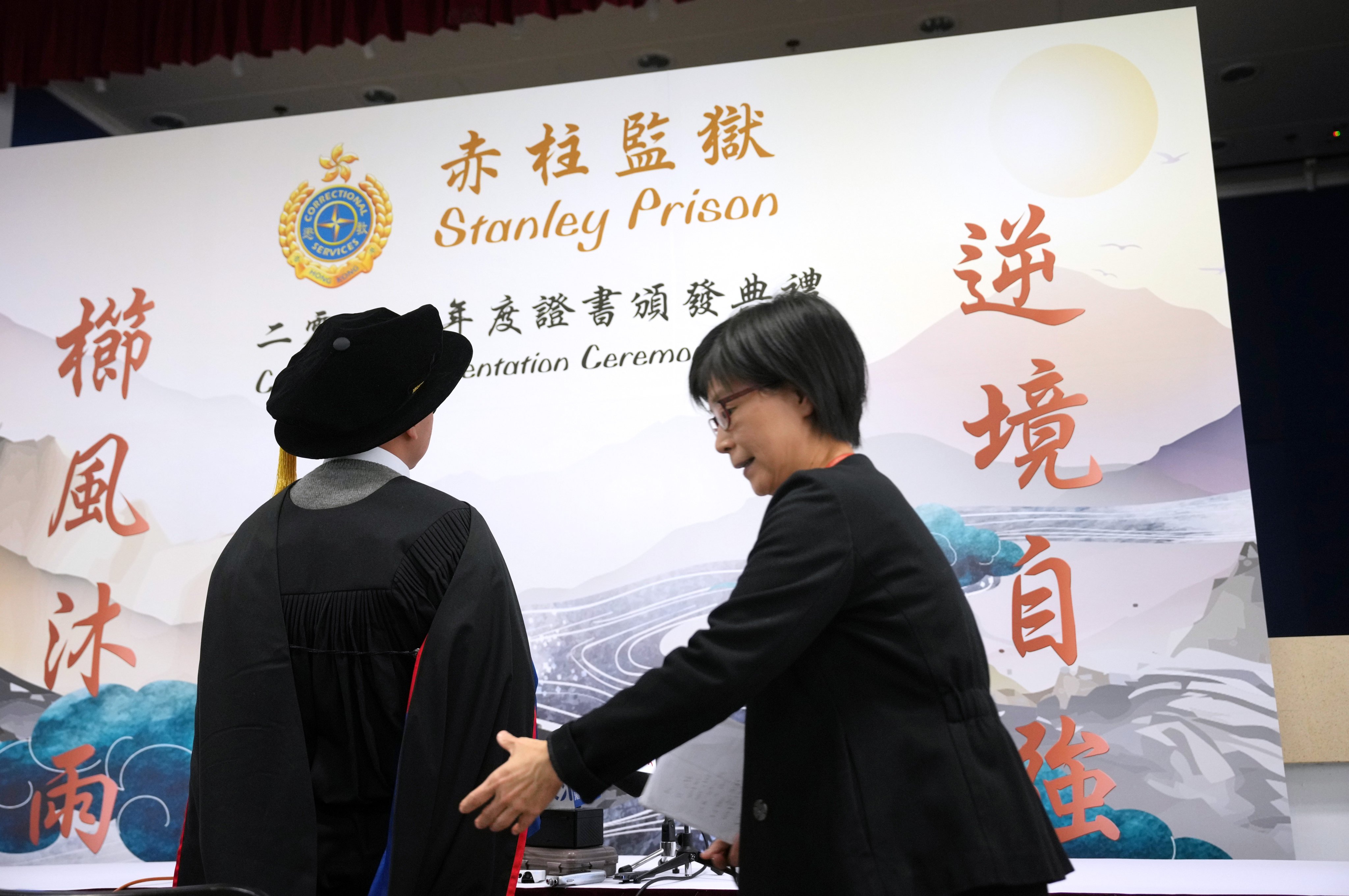 Inmate Chun receives his doctoral degree at a graduation ceremony held in Stanley Prison. Photo: May Tse