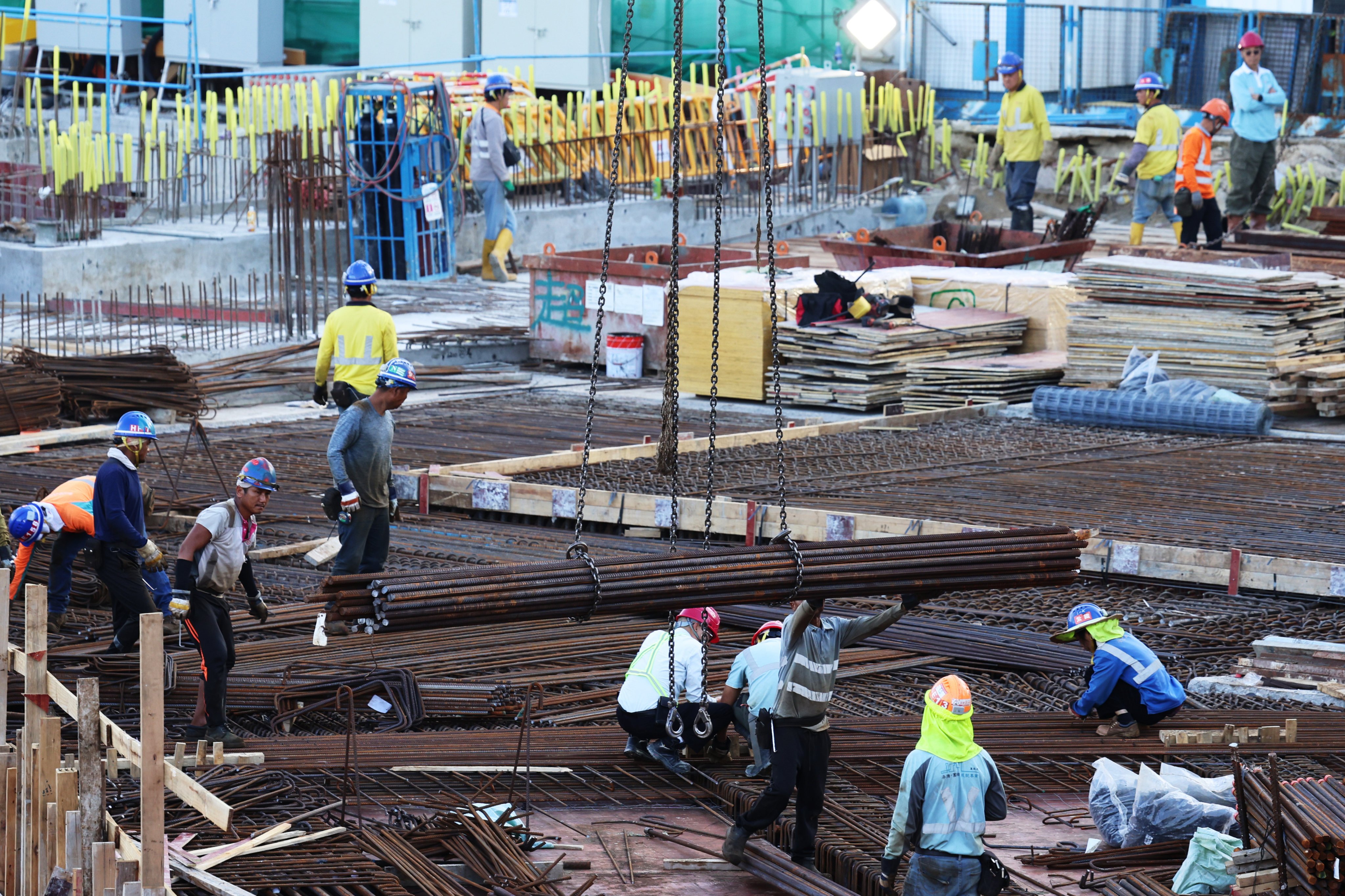 Construction workers work at a construction site in Central, Hong Kong. Photo: Jelly Tse