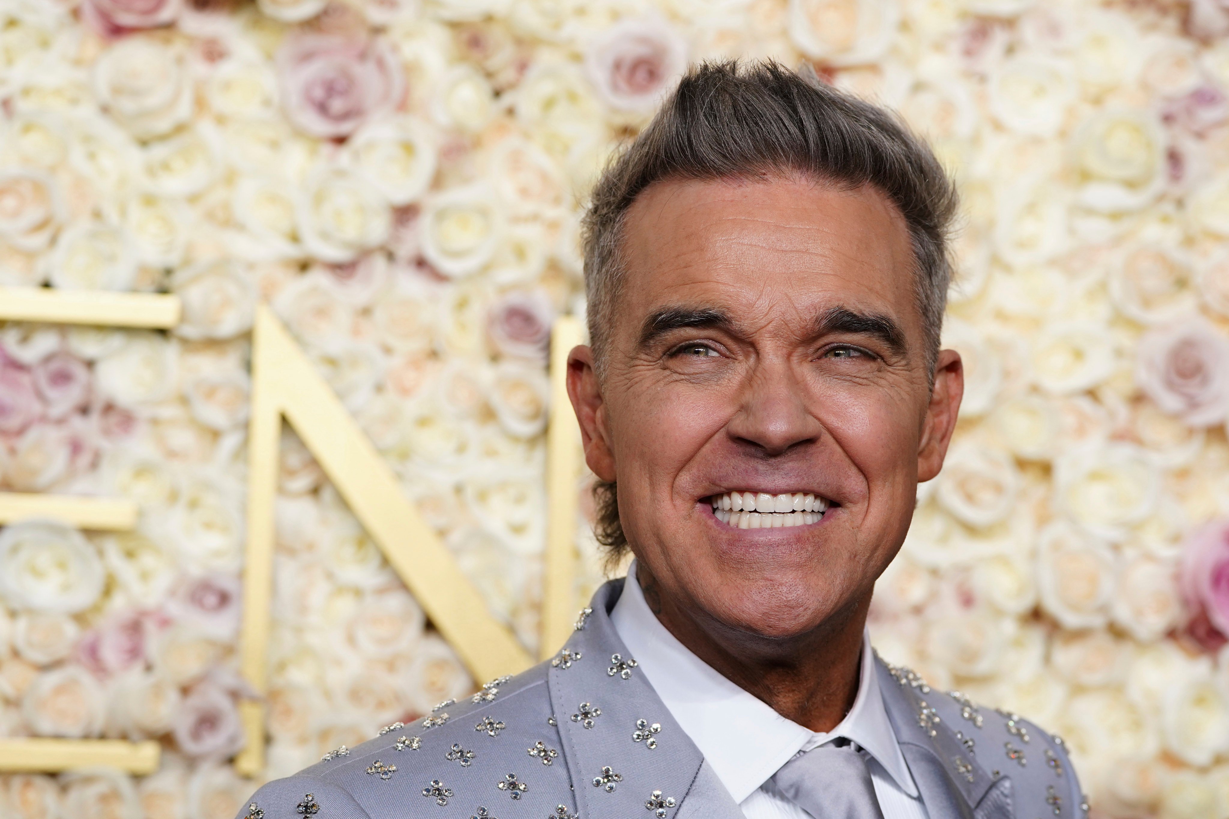 Robbie Williams arrives for the 82nd Golden Globes in California. Photo: Jordan Strauss/Invision/AP