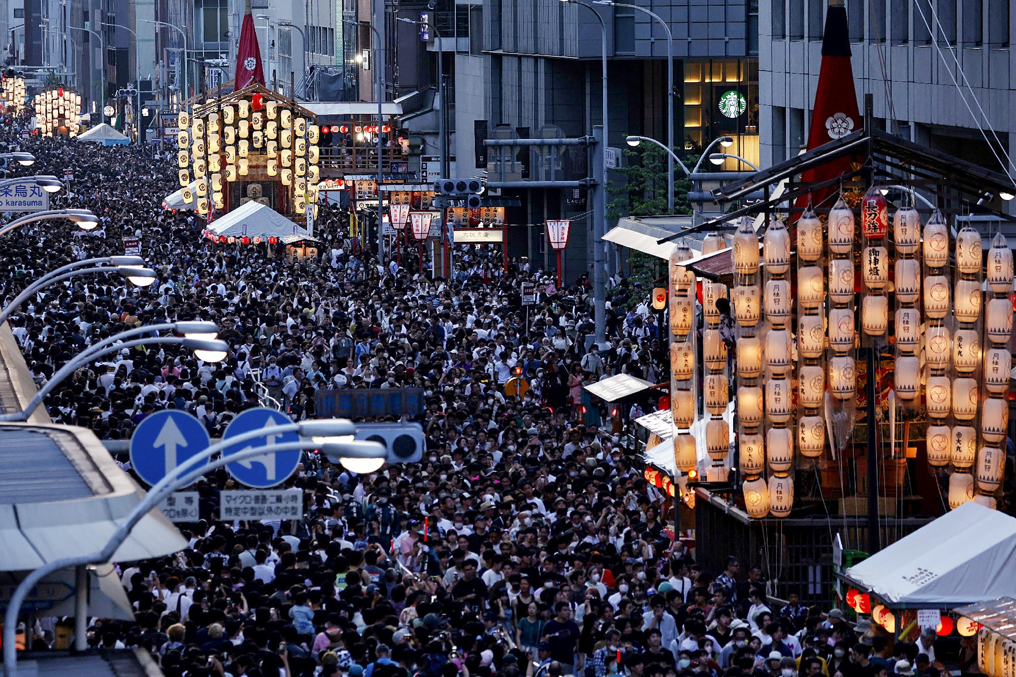 Thousands of people attending a procession ahead of the climax of the Gion festival in Kyoto. Photo: AFP