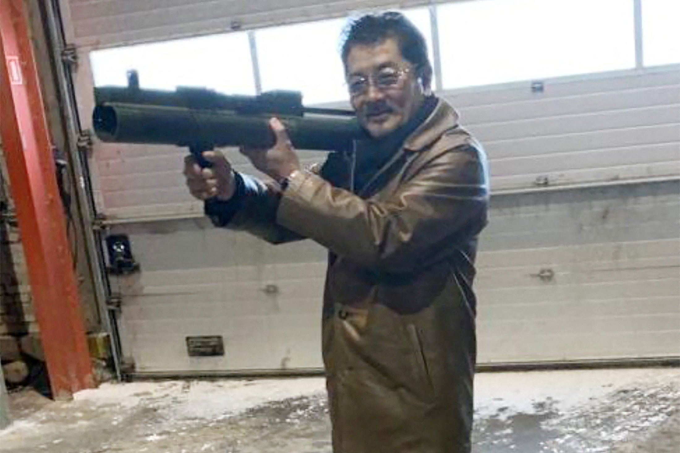 Takeshi Ebisawa poses with a rocket launcher at a warehouse in Copenhagen, Denmark. File photo: Reuters