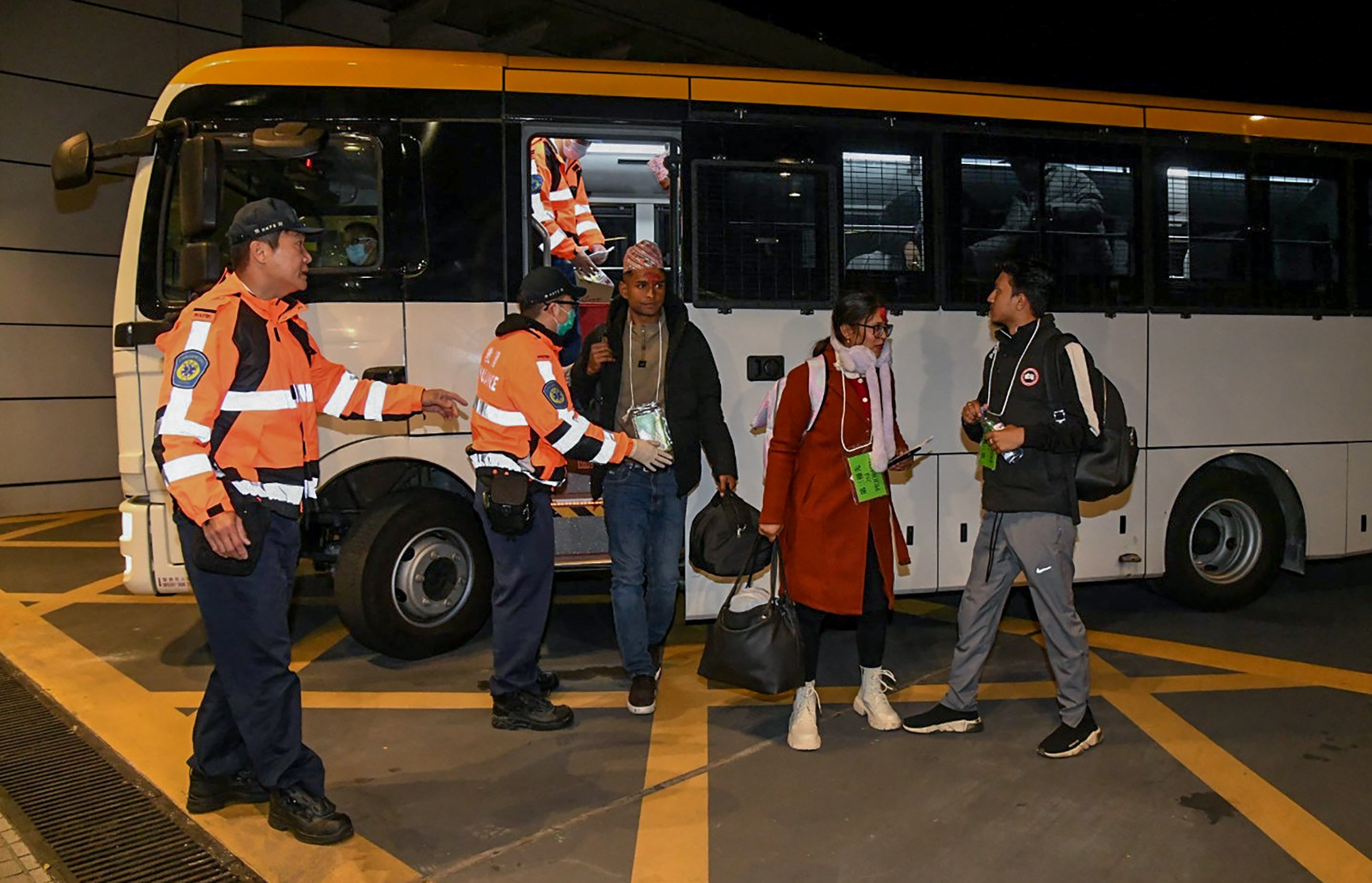 Cathay passengers from Kathmandu who suffered food poisoning are sent to North Lantau Hospital for examination. Photo: Handout