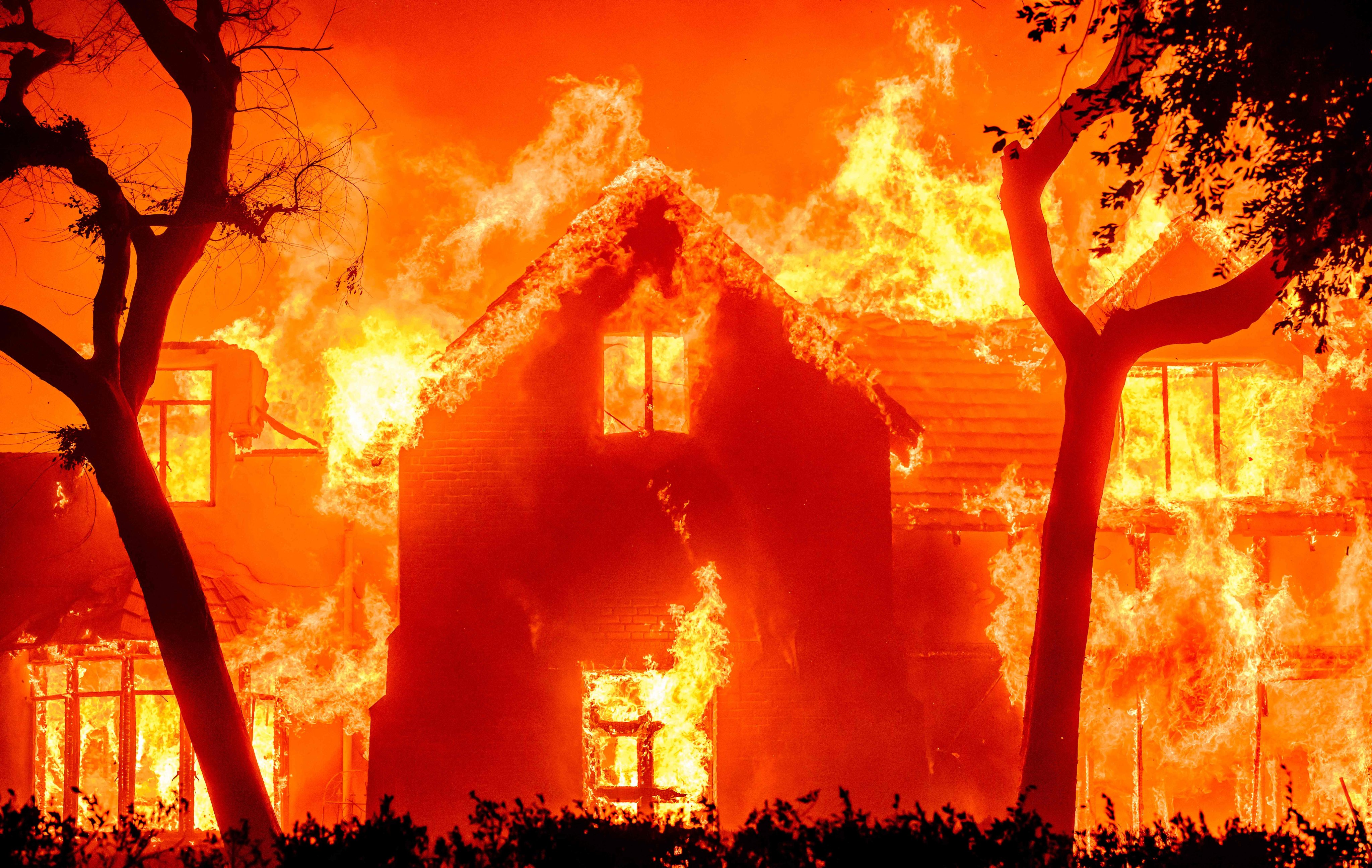 A home is engulfed in flames during the Eaton fire in the Altadena area of Los Angeles County on Wednesday. Photo: AFP