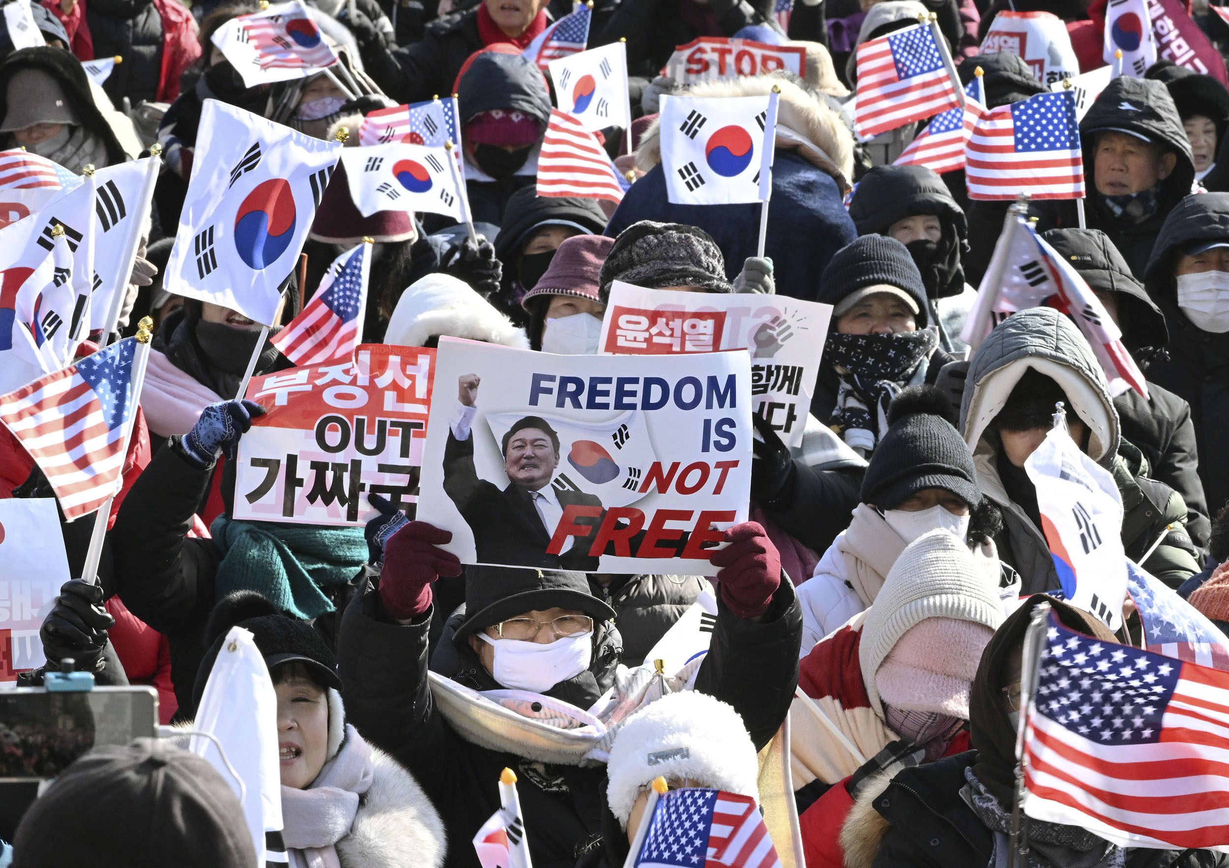 Supporters of impeached South Korean President Yoon Suk-yeol gather near his residence in Seoul on Thursday. Photo: Kyodo