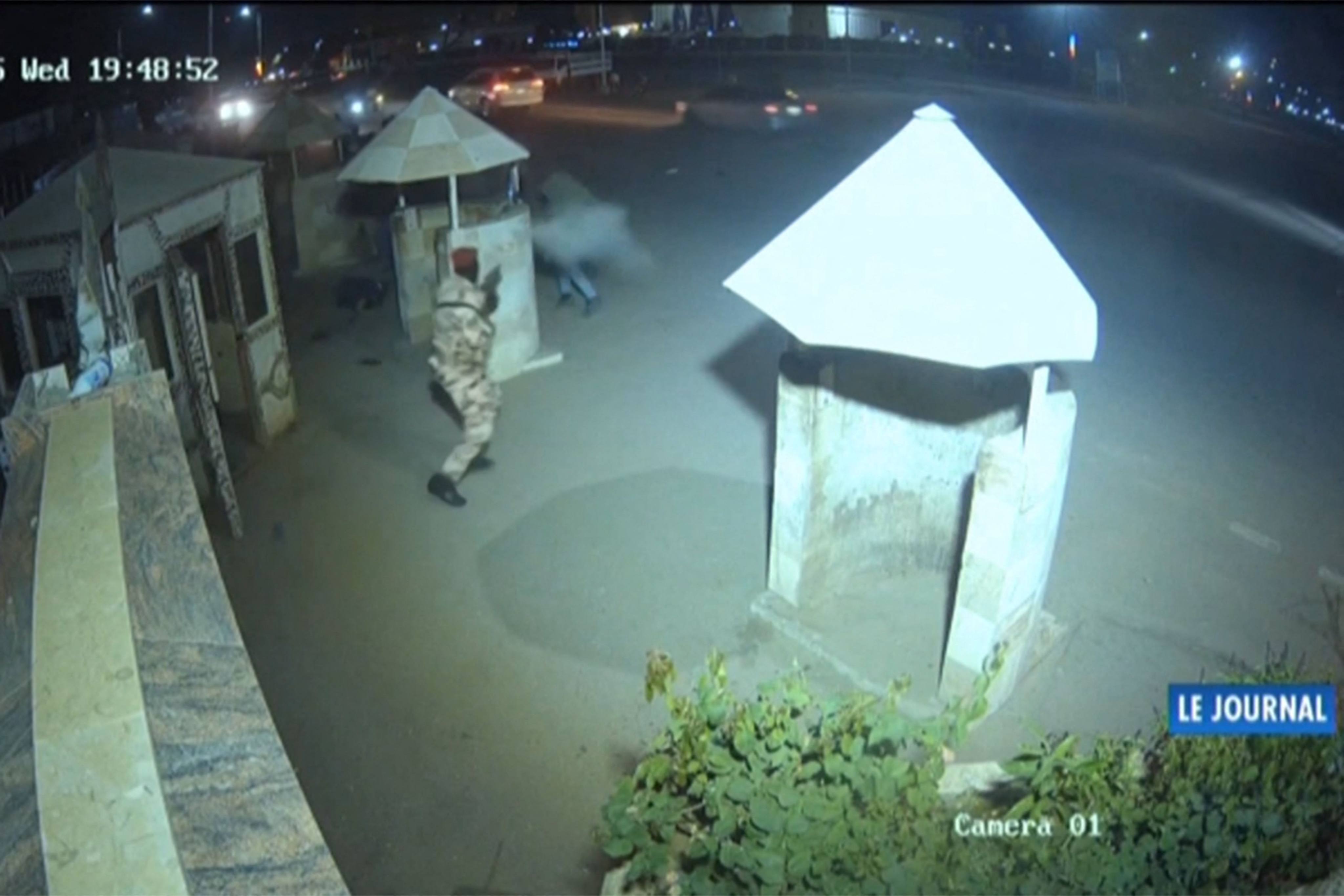 This video grab from a CCTV video of the presidential complex shows a soldier firing at gunmen. Photo:Tele Tchad via AFP