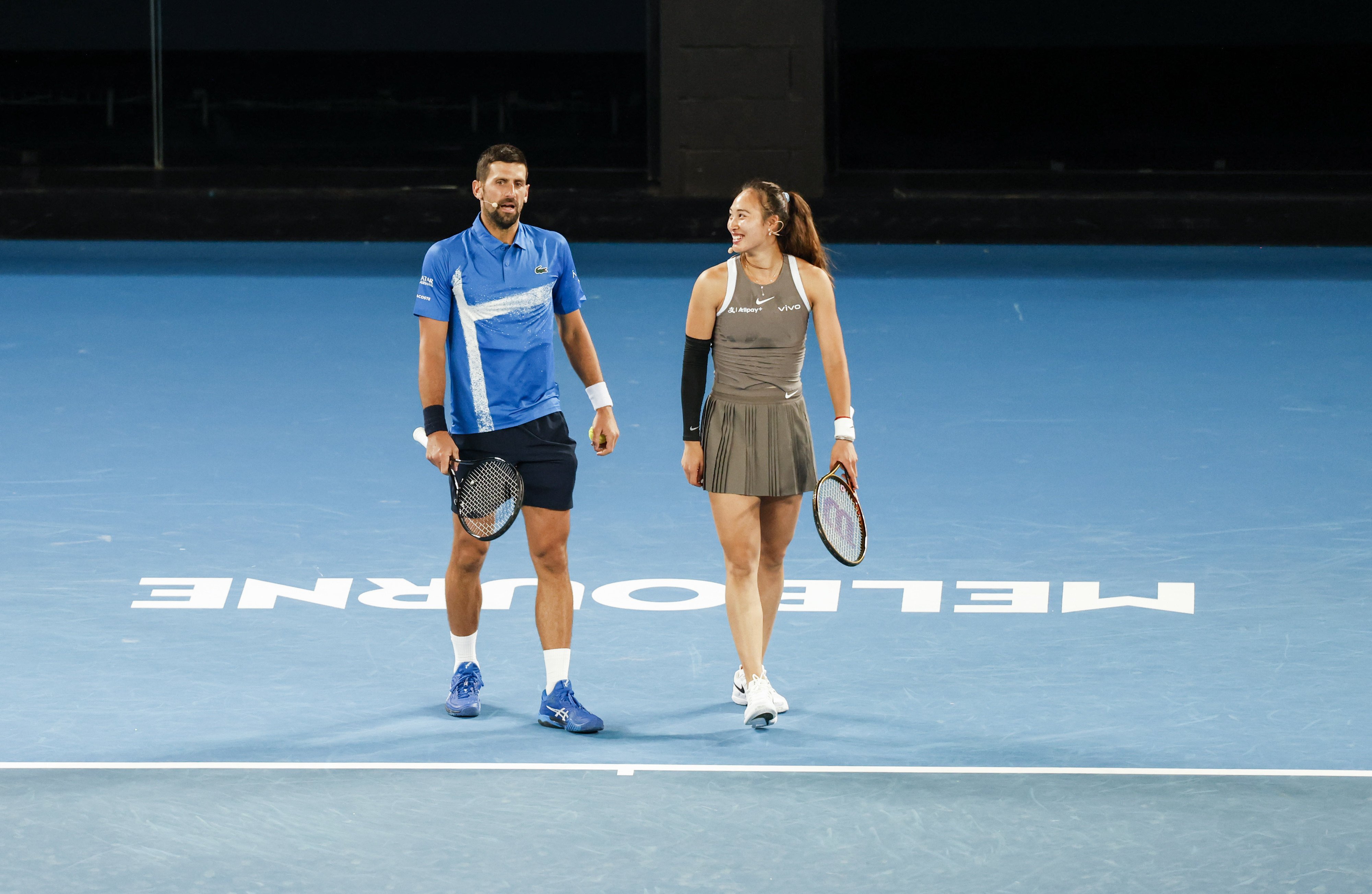 Novak Djokovic and China’s Zheng Qinwen during the “A Night With Novak” charity match against Andy Murray of Britain and Victoria Azarenka of Belarus in Melbourne on Thursday. Photo: Xinhua