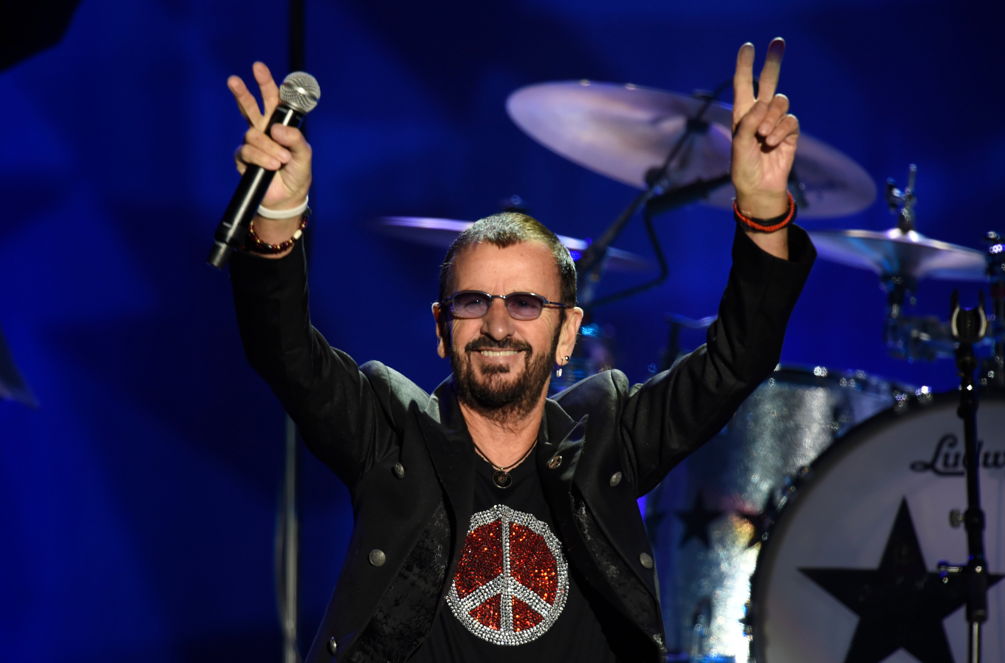 Ringo Starr flashes the peace sign to the crowd at the Reading Eagle Theatre in Pennsylvania. The former Beatles drummer is releasing his second country album. Photo: Getty Images