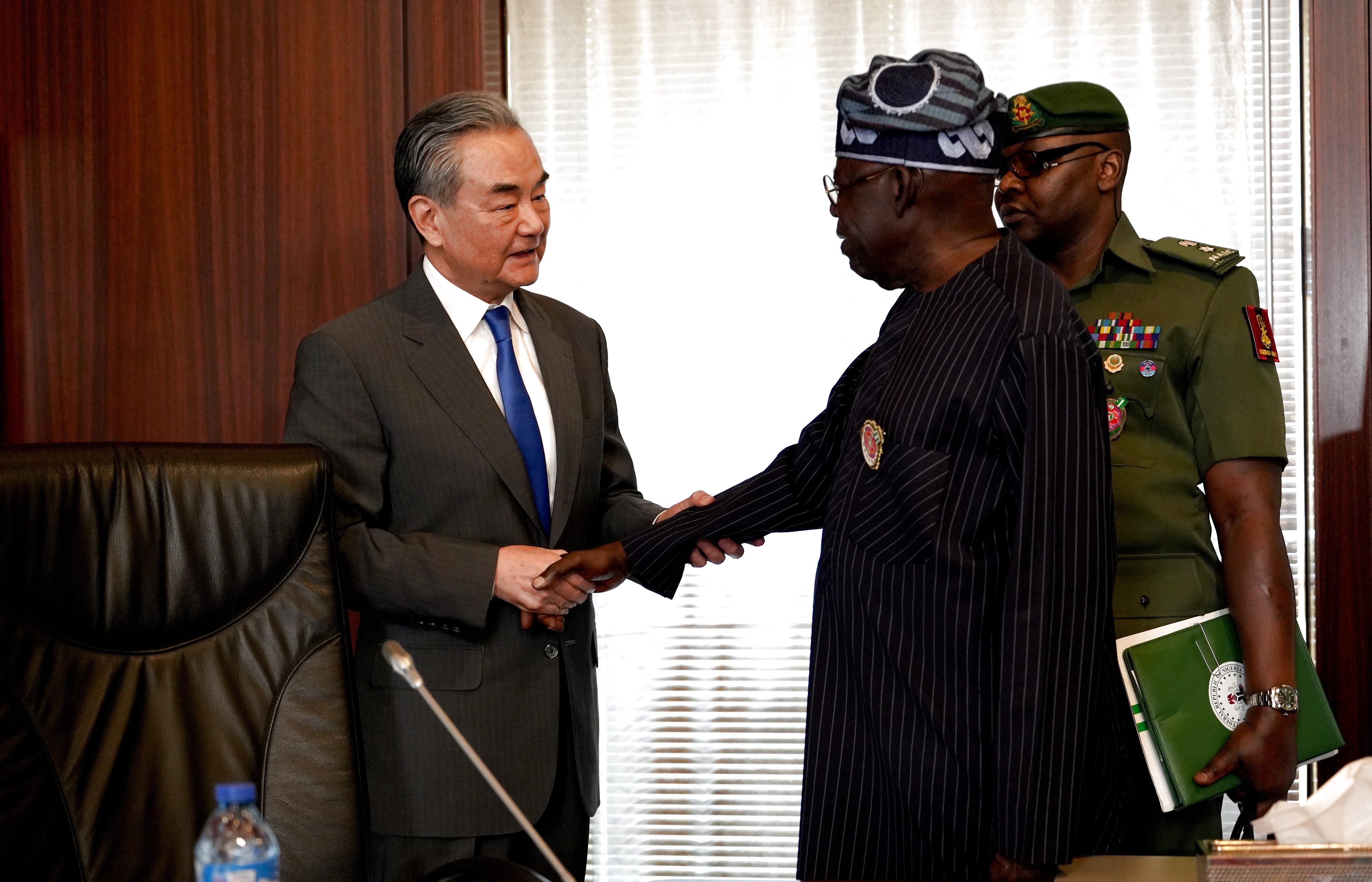 Chinese Foreign Minister Wang Yi with Nigerian President Bola Ahmed Tinubu in the capital Abuja on January 9, a day after the top diplomat’s visit to Chad. Photo: Xinhua