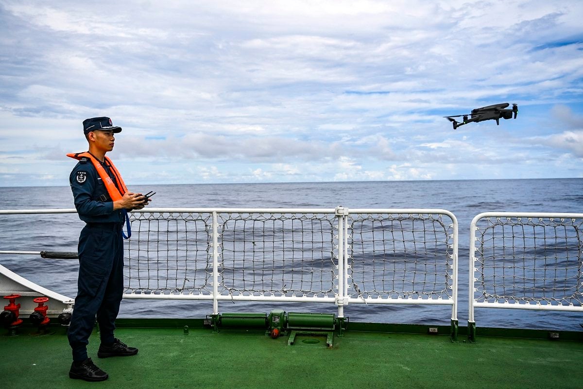 A law enforcer attends a drone training session on China Coast Guard vessel Sifang in waters adjacent to the Scarborough Shoal in the South China Sea on September 14. Photo: Xinhua