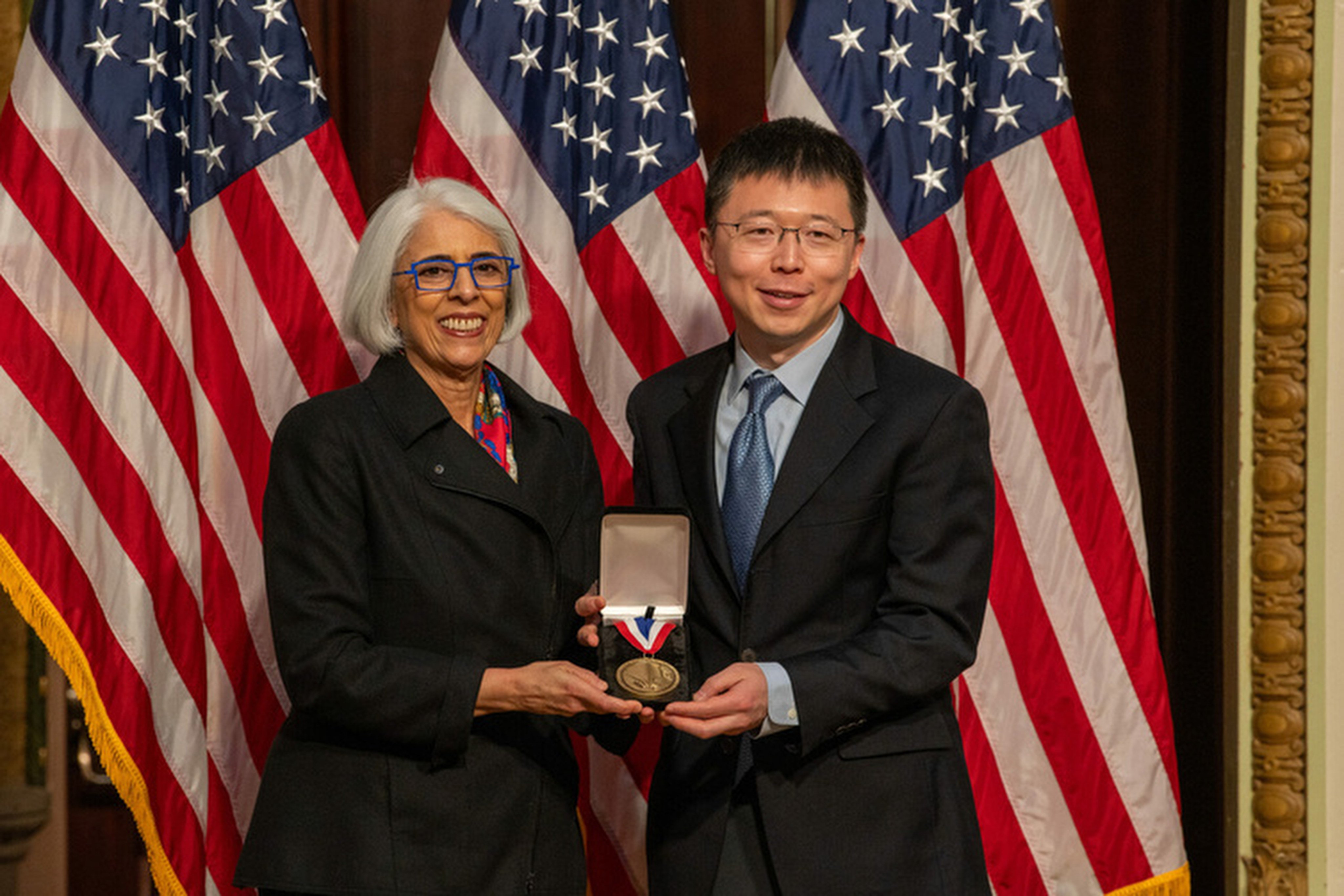 White House director of science and technology policy Arati Prabhakar (left) presents China-born MIT professor Zhang Feng with the National Medal of Technology and Innovation. Photo: Ryan K. Morris