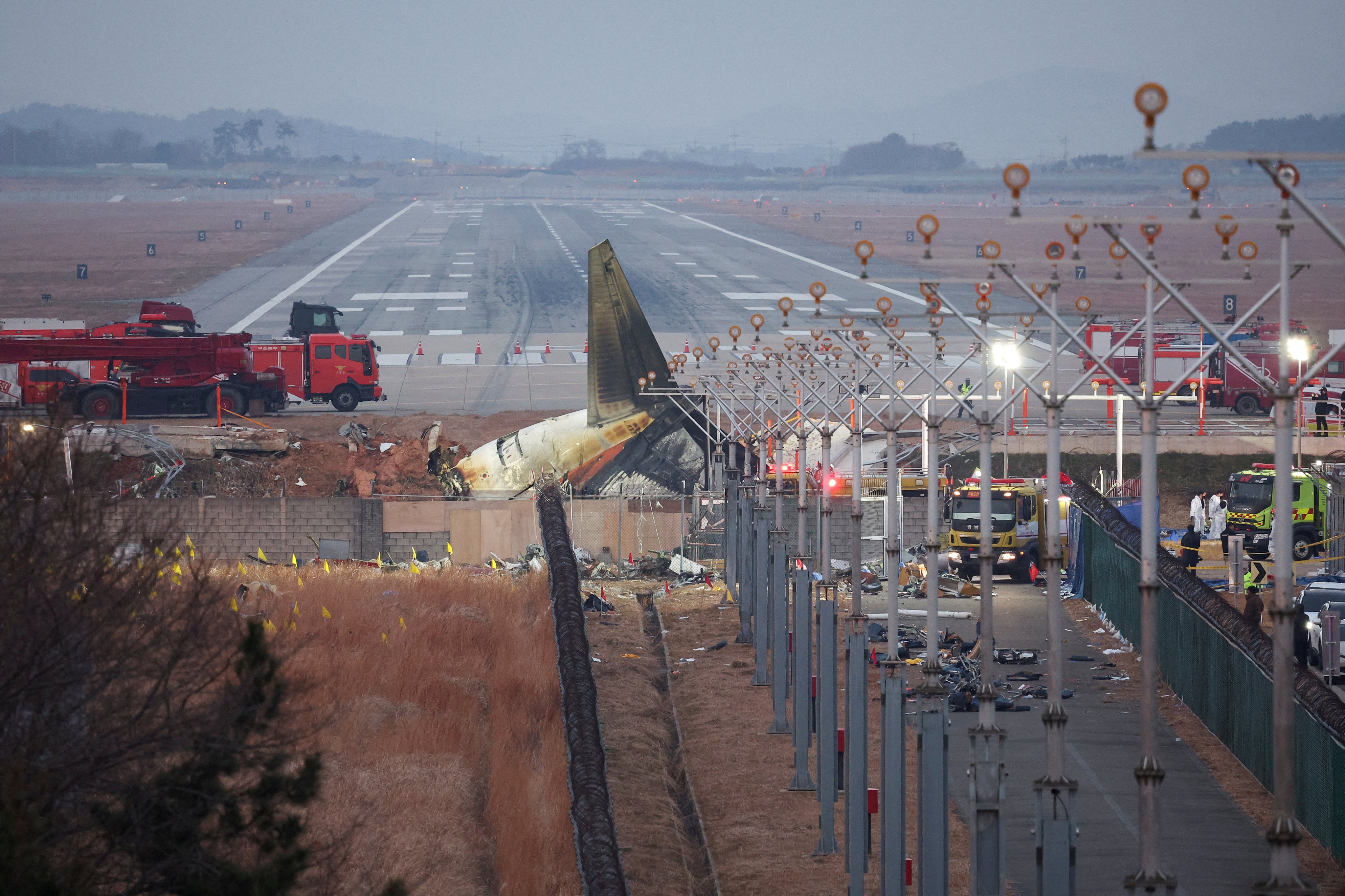 The wreckage of the crashed Jeju Air jet lies at Muan airport in South Korea on December 30. Photo: Reuters