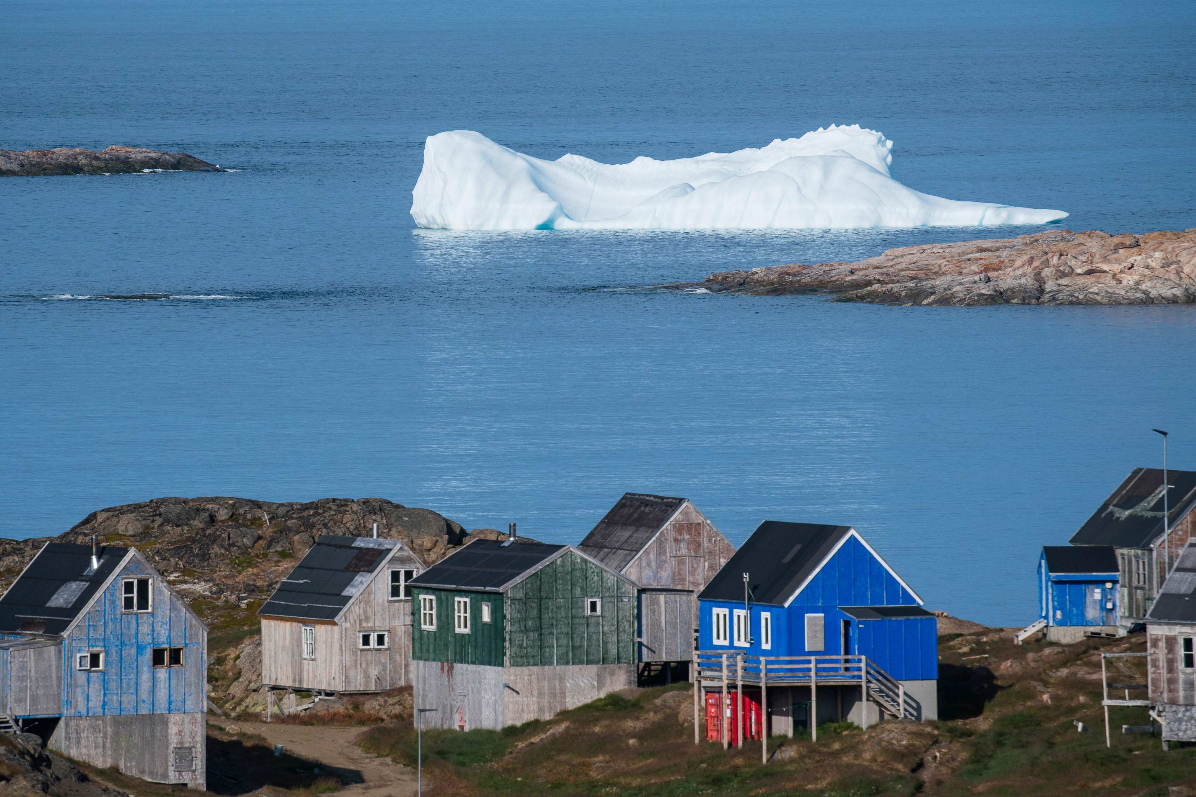 Icebergs float behind the town of Kulusuk in Greenland. US president-elect Donald Trump has threatened to invade the Danish territory. Photo: AFP