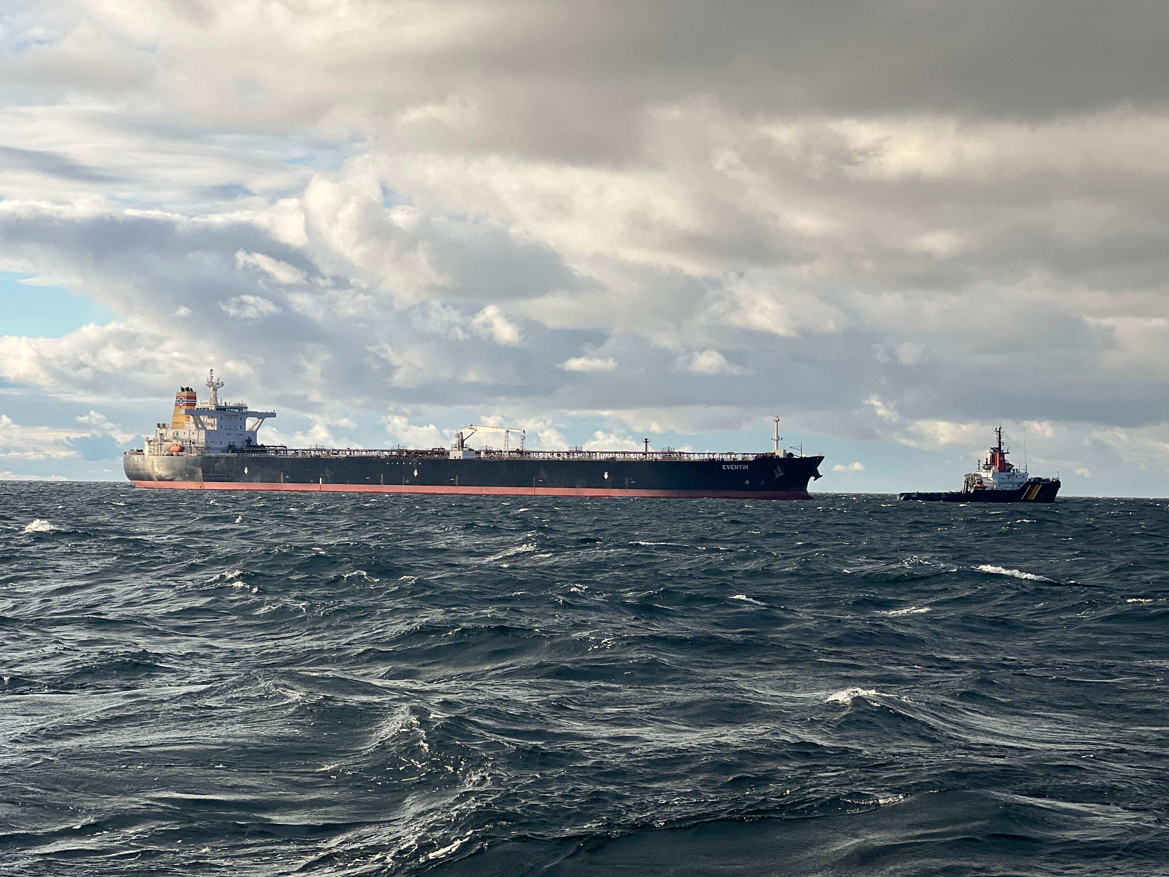 The tanker ‘Eventin’, flying the Panama flag, as a towing connection is established from the emergency tug boat Bremen (right) at sea north of the German Baltic Sea island of Ruegen, on Friday. Photo: AFP