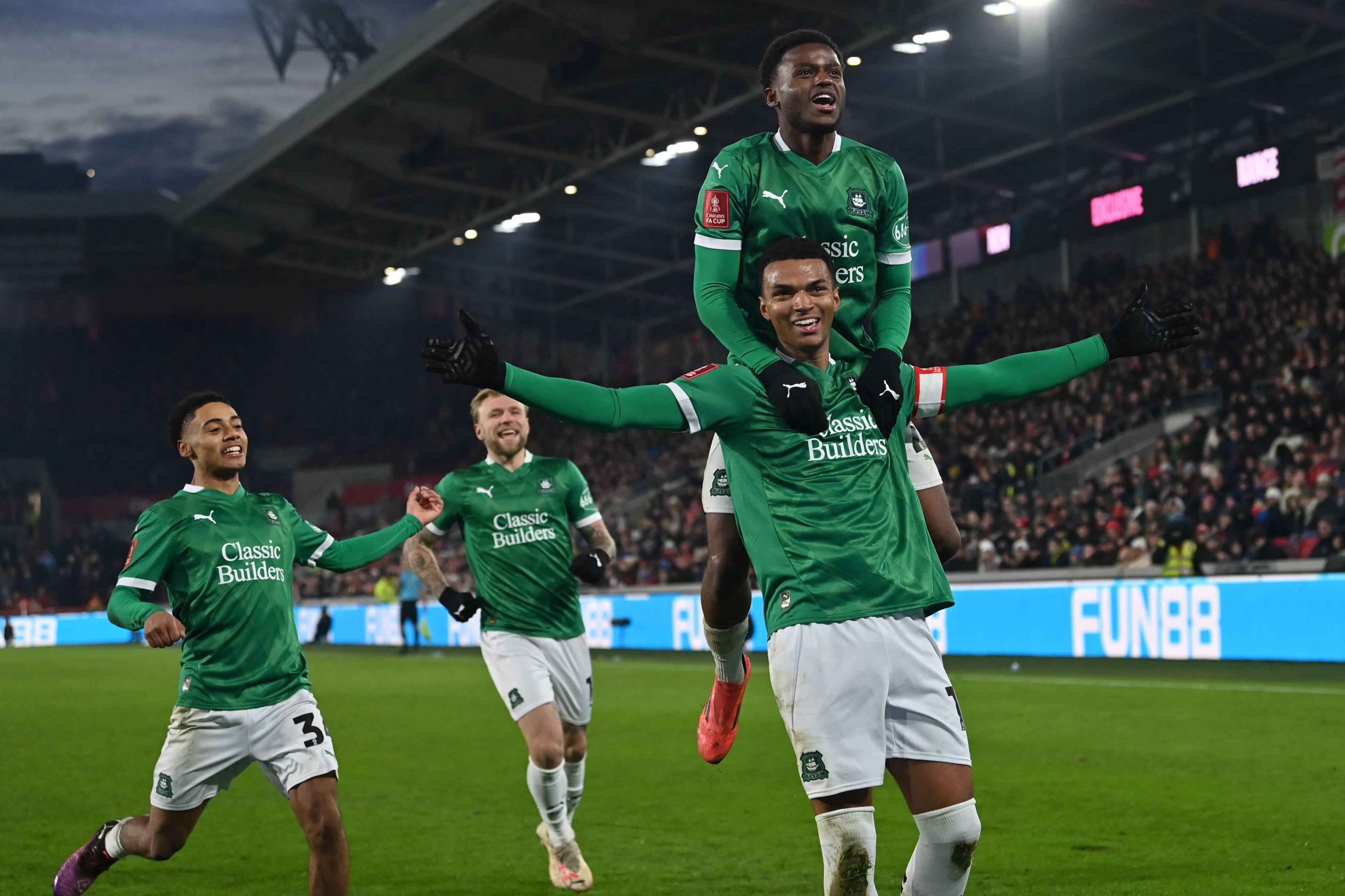 Morgan Whittaker (centre) celebrates scoring his side’s winner against  Brentford at the Gtech Community Stadium. Photo: AFP