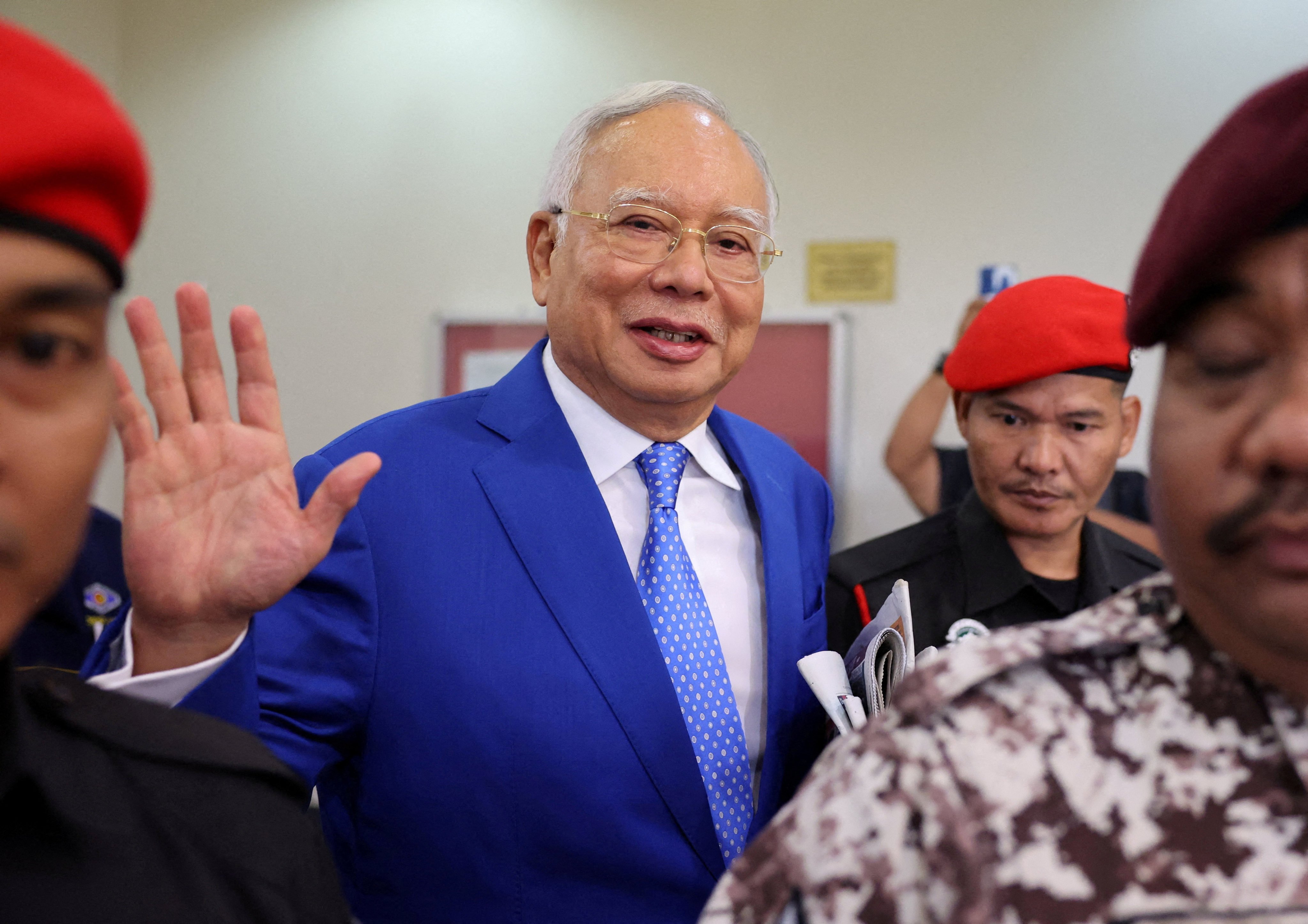 Former Malaysian Prime Minister Najib Razak waves after court proceedings in Kuala Lumpur last year. Photo: Reuters