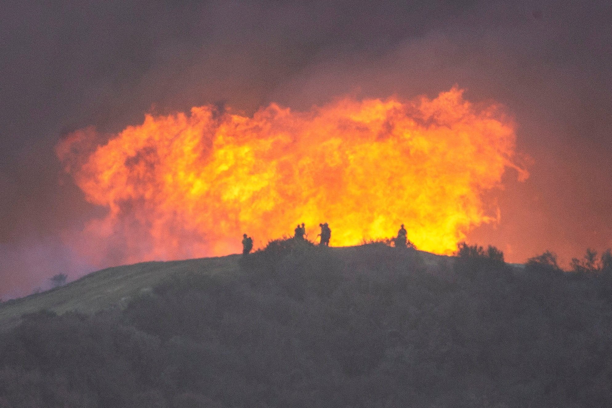 Firefighters battle the Palisades fire in California on Sturday. Photo: Reuters