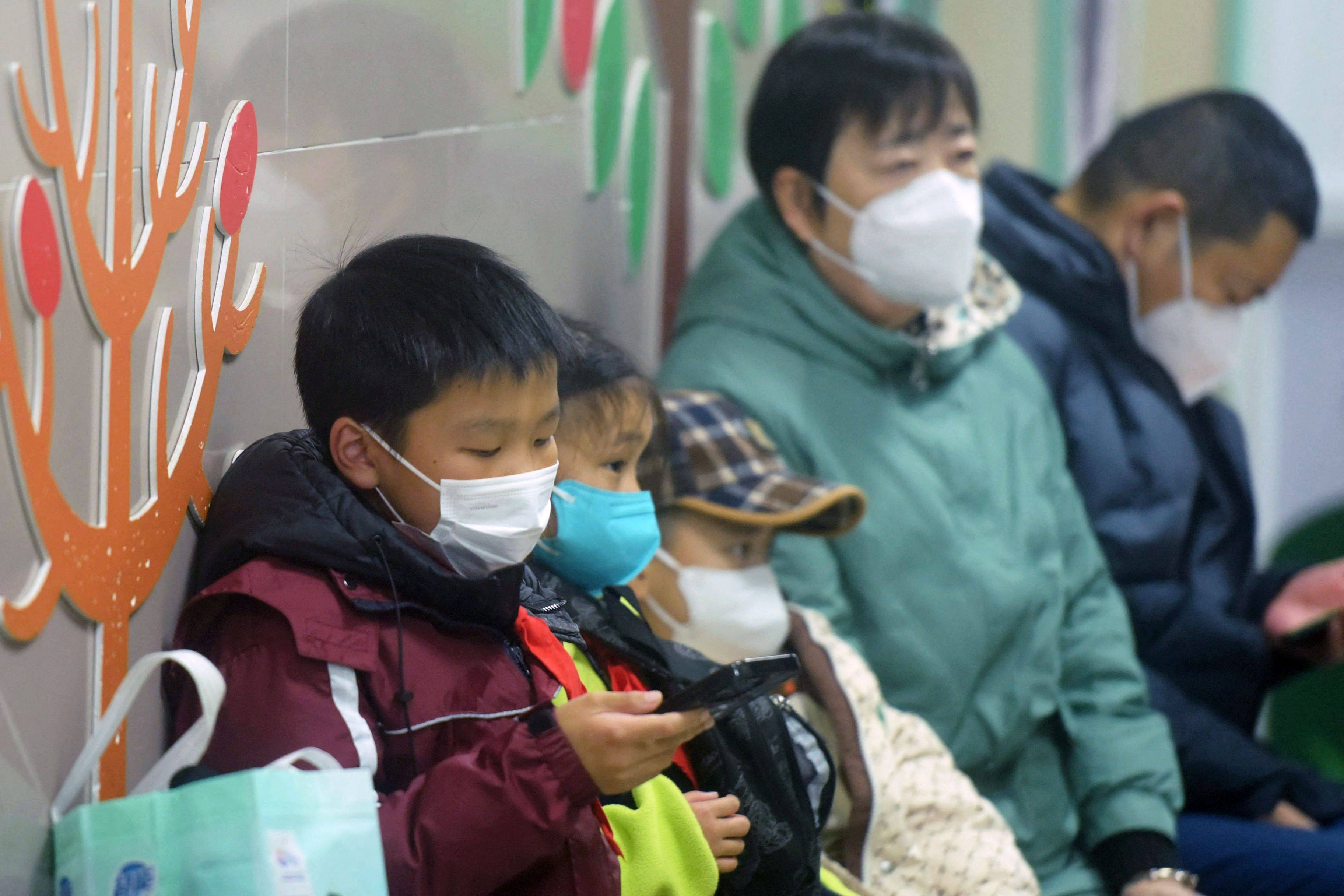 Children wait to be seen at the paediatric department of a hospital in eastern China last week. Photo: AFP