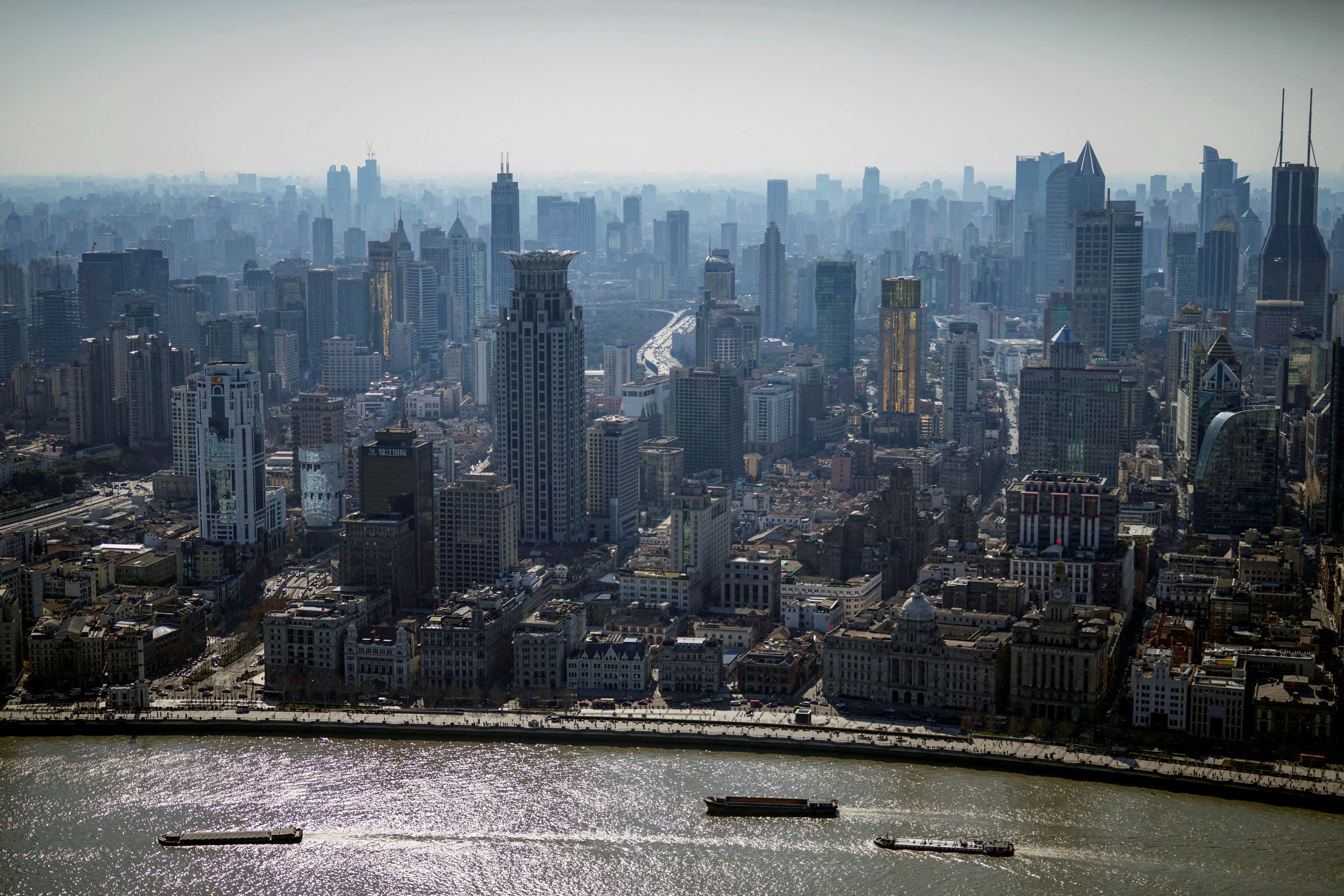 A view of the city skyline and Huangpu river in Shanghai, on February 24, 2022. Photo: Reuters