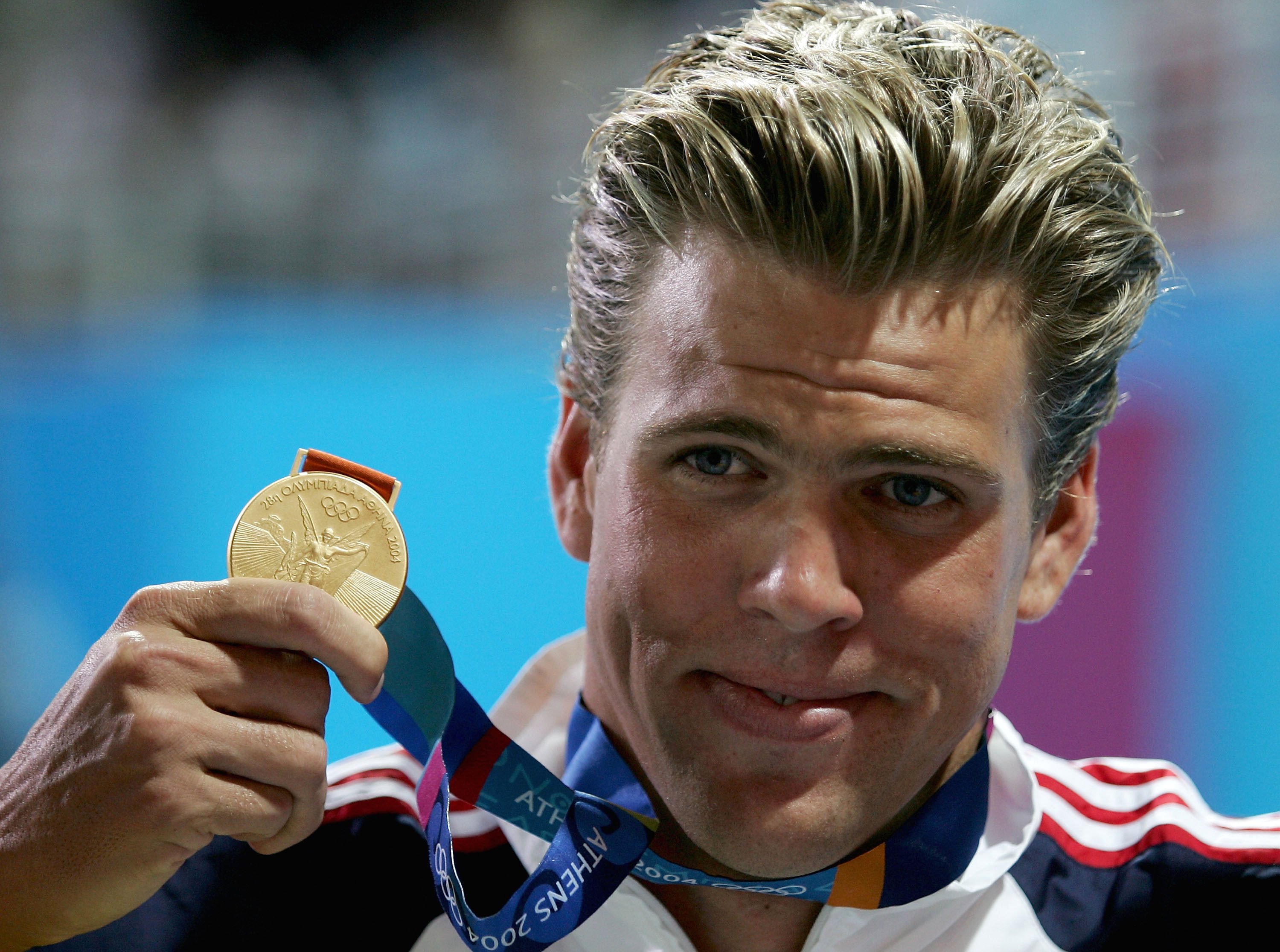 Gary Hall Jnr with his gold medal from the 50-metre freestyle at the 2004 Athens Olympics. Hall competed at the 1996 and 2000 Games as well, winning five gold, three silver and two bronze medals in all. Photo: TNS